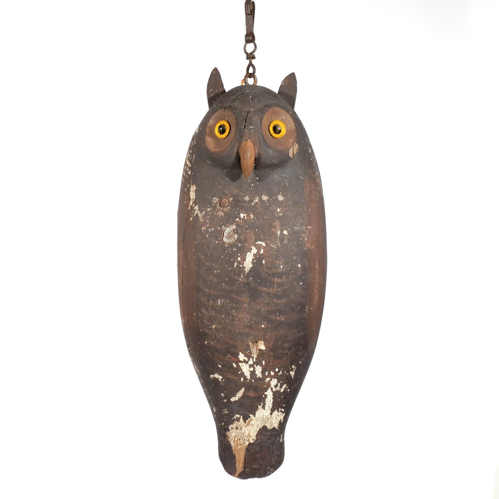 GREAT HORNED OWL DECOY: Early 20th century, carved and painted wood, with glass eyes and leather 'horns', no apparent signature h. 18-1/2 w. 7 d. 4-1/2 in. Provenance: Private collection, Bernardsville, NJ