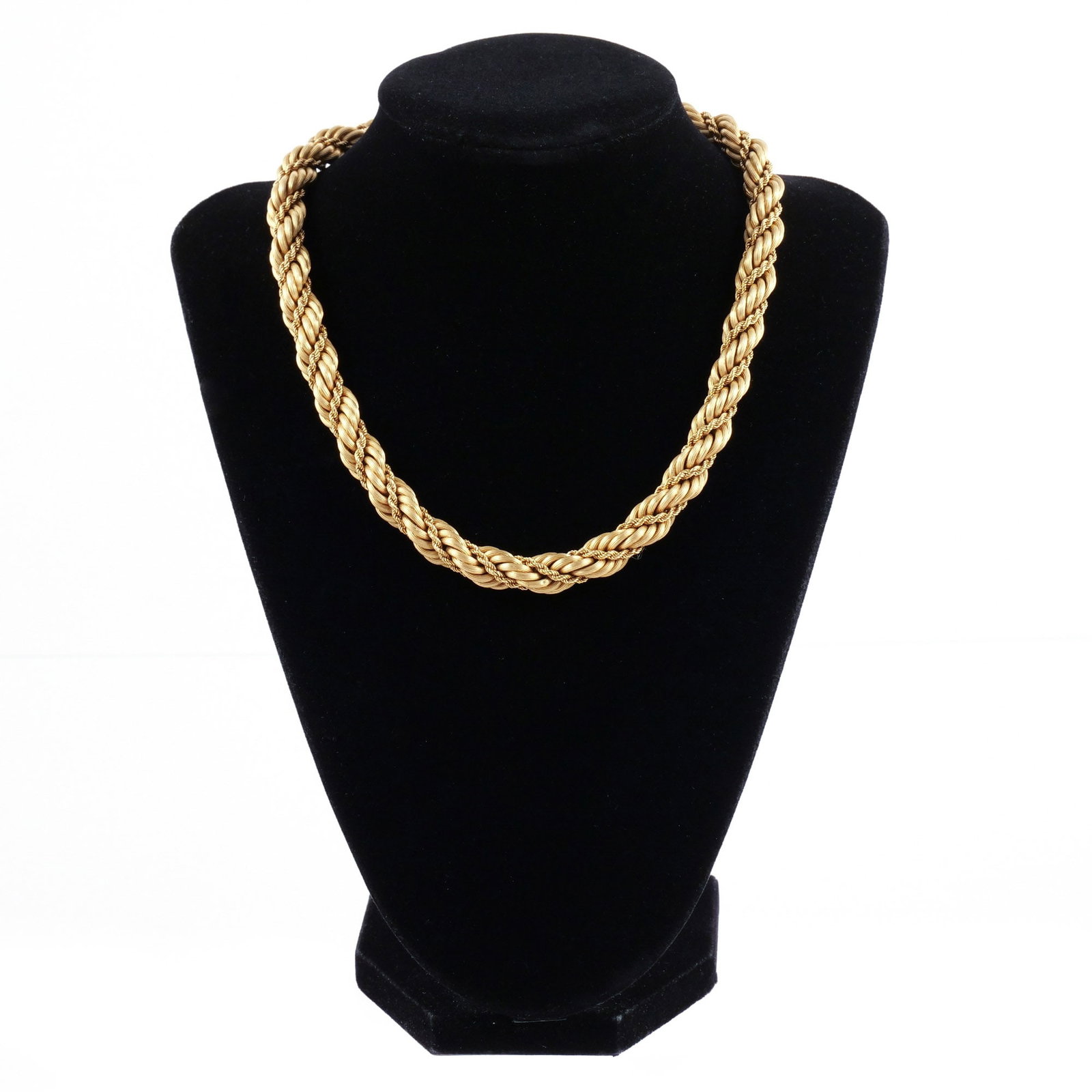 TIFFANY & CO. 18K ITALIAN GOLD ROPE NECKLACE: Composed of textured twisted gold rope intertwined with a smaller rope, signed 'Tiffany & C.' and marked 'Italy / 18k', l. 16-1/4 in., 68 g w. 3/8 in. Provenance: Descent through the consignor's famil