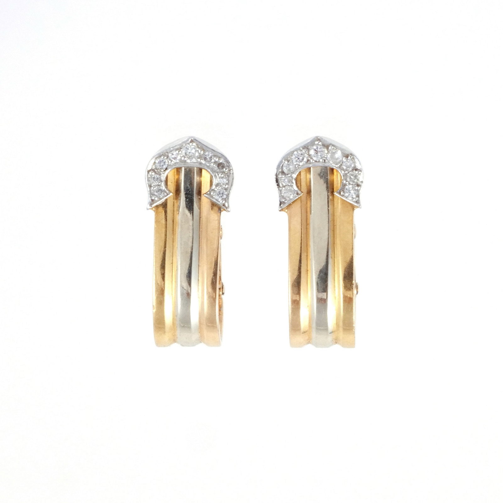 PAIR CARTIER 18K TRICOLOR 'DOUBLE C' EAR CLIPS: Designed as ribbed tri-color gold half-hoops terminating in diamond-set Cartier signature Cs, signed 'Cartier' and marked '750' and numbered, l. 11/16 in., 5.1 g total weight