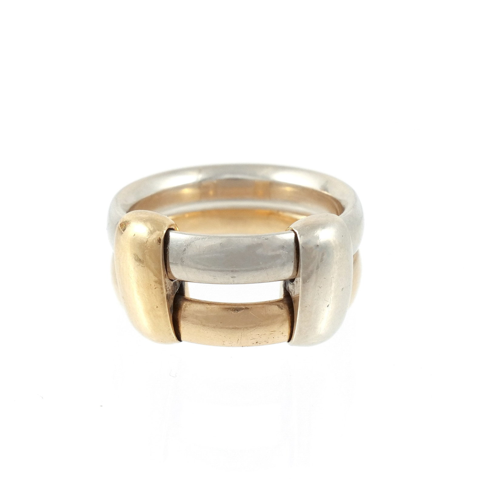 (Attrib.) HERMES 18K TWO-TONE GOLD CONJOINED RING: Composed of two parallel bands joined by movable vertical connectors, with French assay mark and marked 'Made in France' with indistinct manufacturer's mark possibly 'Ste. G', size 5-3/4, 12.9 g