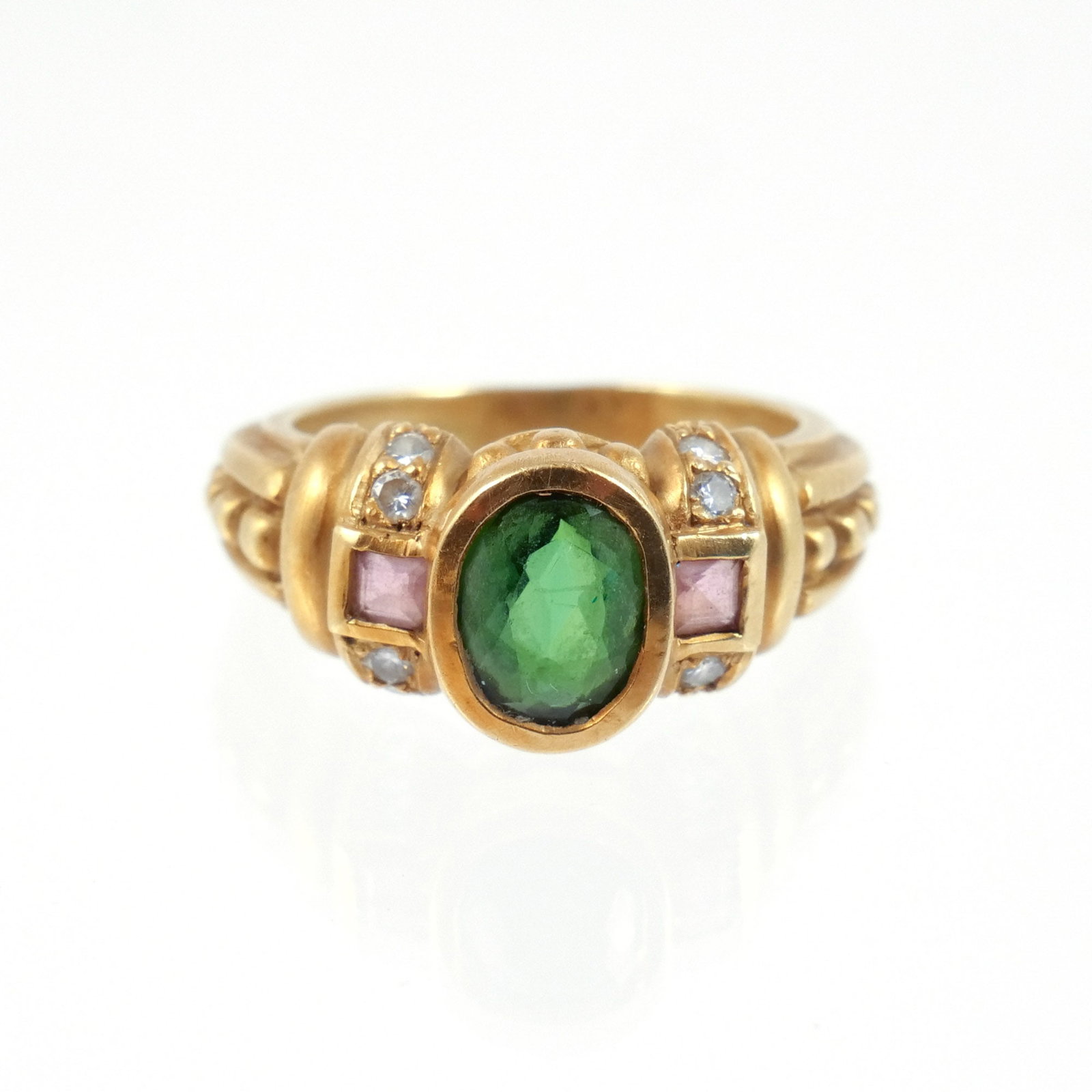 JUDITH RIPKA 18K GOLD & GEMSTONE RING: Centering an oval bezel-set faceted green gemstone flanked by square-cut pink gemstones, likely tourmaline, and melee diamonds, signed '(c) Judith / Ripka' and marked '18K', size 6-1/4, 8.4 g total we