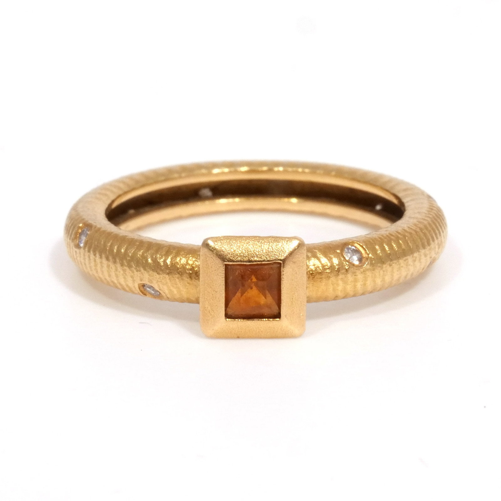 (Attrib.) PAUL MORELLI 18K GOLD & CITRINE RING: Textured band accented by 10 flush-set round diamonds and centering a 2.6mm square citrine in a hammered and beveled setting, marked '18k', apparently unsigned, size 6-1/4, 4.5 g total weight Provenan
