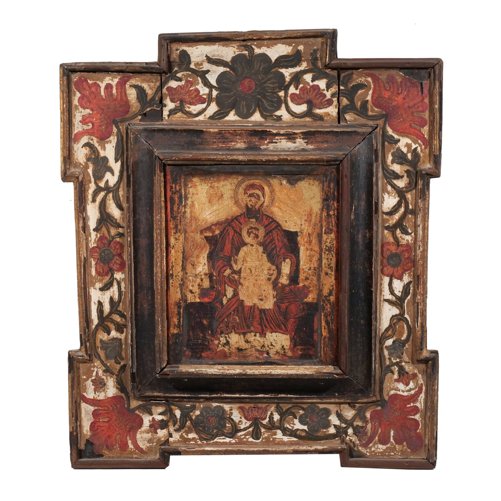 GREEK ICON in an ITALIAN FRAME: 17th/18th century, showing the Enthroned Mother of God, in an Italian paint-decorated frame h. 10 w. 8 in. overall: 21 x 18 in. (framed) Provenance: The estate of noted artist and author Edward Giobbi