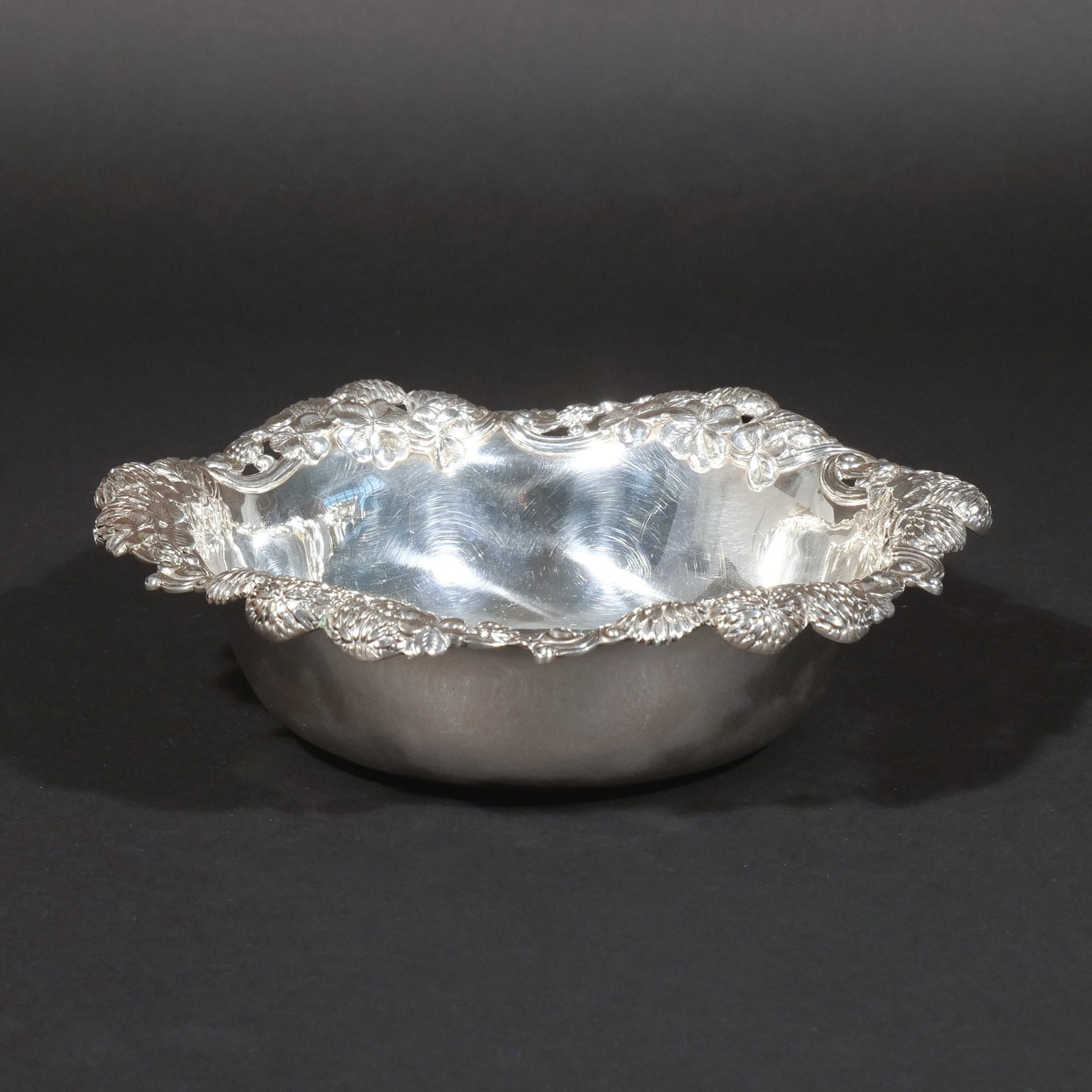 TIFFANY & CO. 'CLOVER' STERLING SILVER BOWL: With molded clover rim, signed 'Tiffany & Co.' and 'M' for John C. Moore and marked 'Sterling Silver / 925-1000', 14 ozt h. 2-1/2 in. dia. 9 in. Provenance: Private collection, Mount Kisco, NY [In Sit