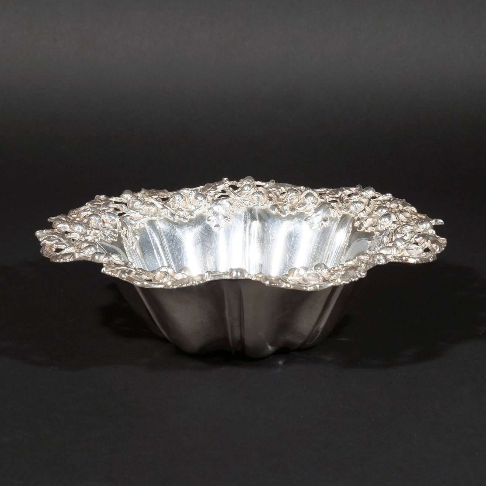 WOODSIDE STERLING SILVER BOWL: With repousse and open work acorn and oak leaf motif border, maker's mark for Woodside & Co., stamped 'Sterling', 15 ozt h. 3 in. dia. 10-1/2 in. Provenance: Private collection, Mount Kisco, NY [In Si