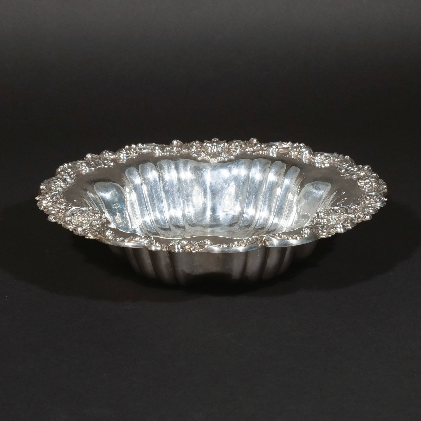 SHREVE CRUMP & LOW STERLING SILVER BOWL: With lobed interior and scrollwork border en repousse, maker's mark and stamped 'Sterling', 11 ozt h. 2-1/2 in. dia. 11 in. Provenance: Private collection, Mount Kisco, NY [In Situ Item] This item wil