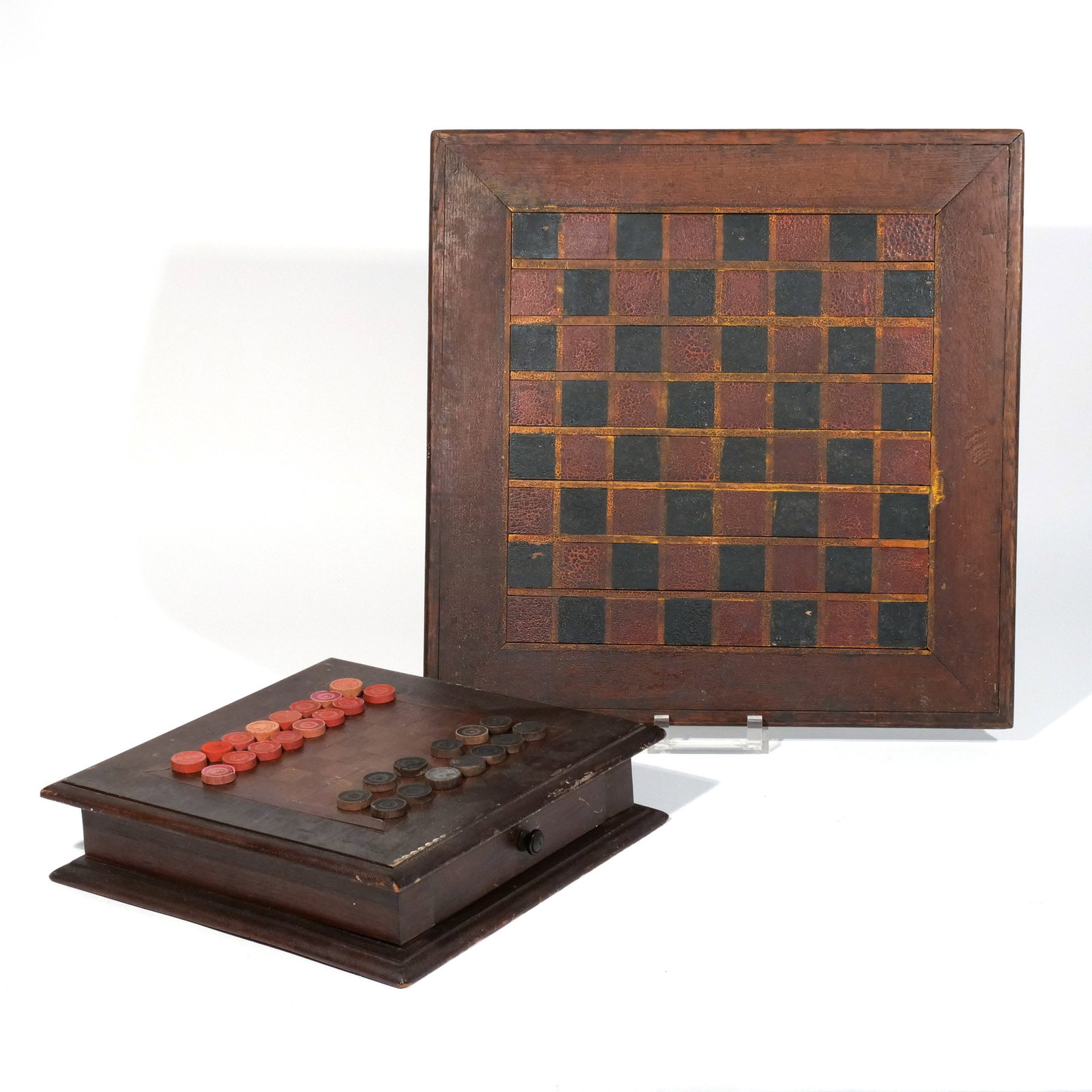 (2pc) ANTIQUE CHECKER GAMEBOARDS: Late 19th / early 20th century, including a square board painted in red, black, and yellow; and a board with single drawer beneath to hold the checkers h. 19-1/2 w. 19-1/2 in. (largest) Provenance: