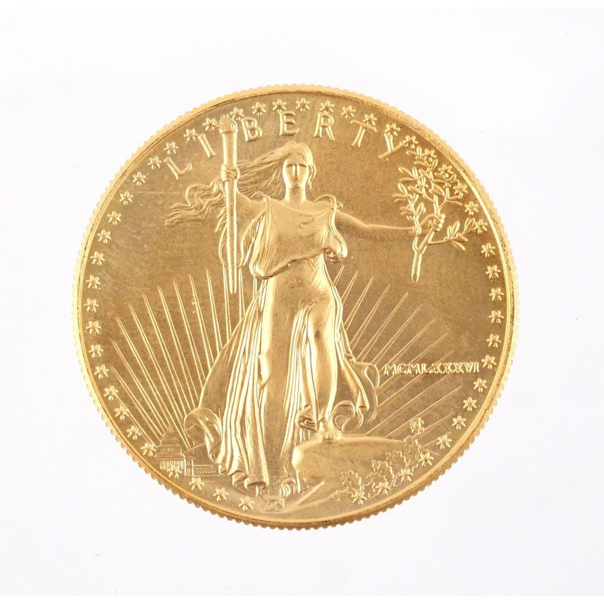1986 US LIBERTY $50 GOLD COIN: With Walking Liberty front and bald eagle in flight on reverse, dated 1986 in Roman numerals, 1 ounce fine gold Provenance: The estate of Gentleman