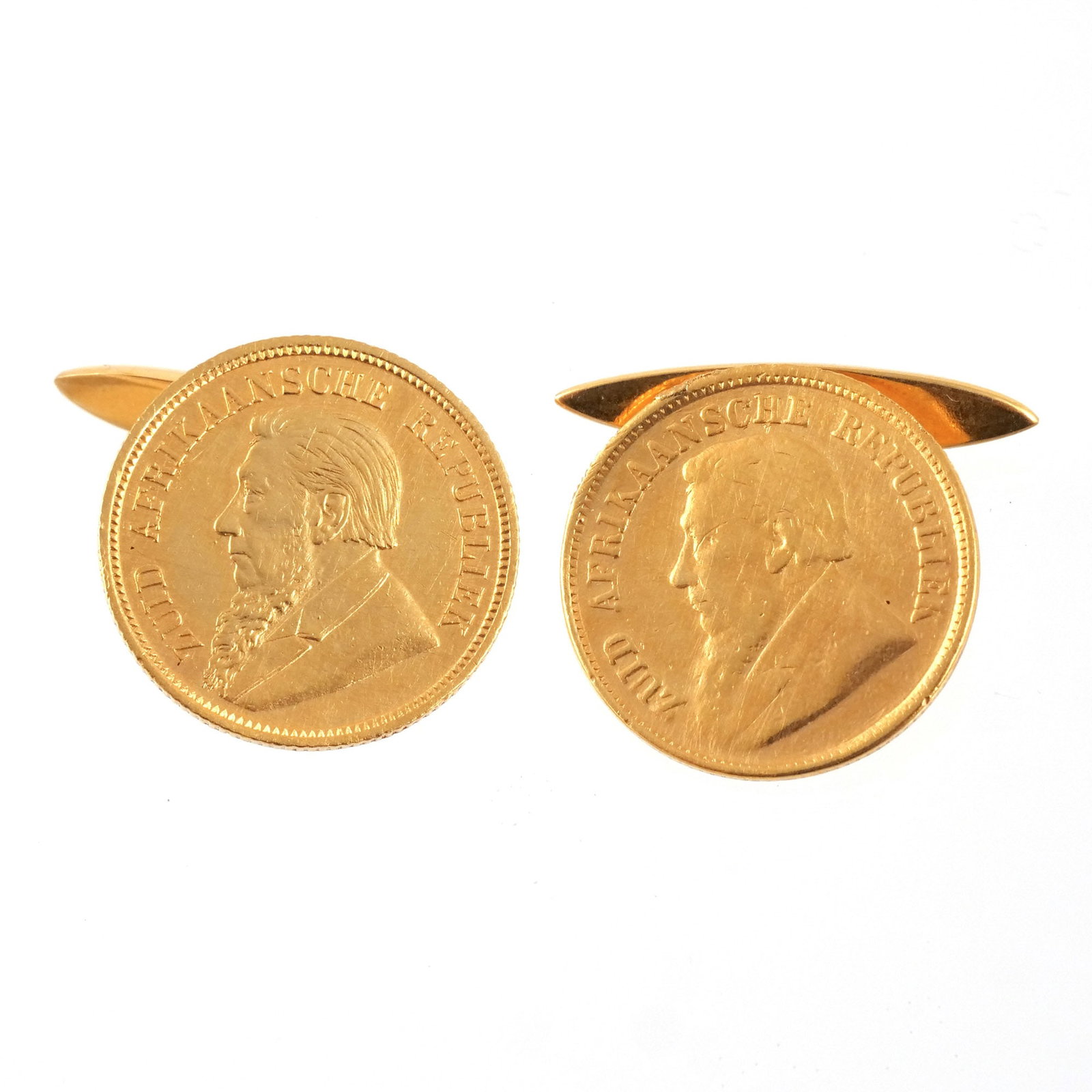 PAIR of GOLD COIN CUFFLINKS: 22k South African Republic half pond coins dated 1894 and 1897 mounted as cufflinks, cufflinks unmarked but test as 14k, 13.2 g total weight w. 3/4 in. (cufflink) dia. 3/4 in. (coin) Provenance: The e
