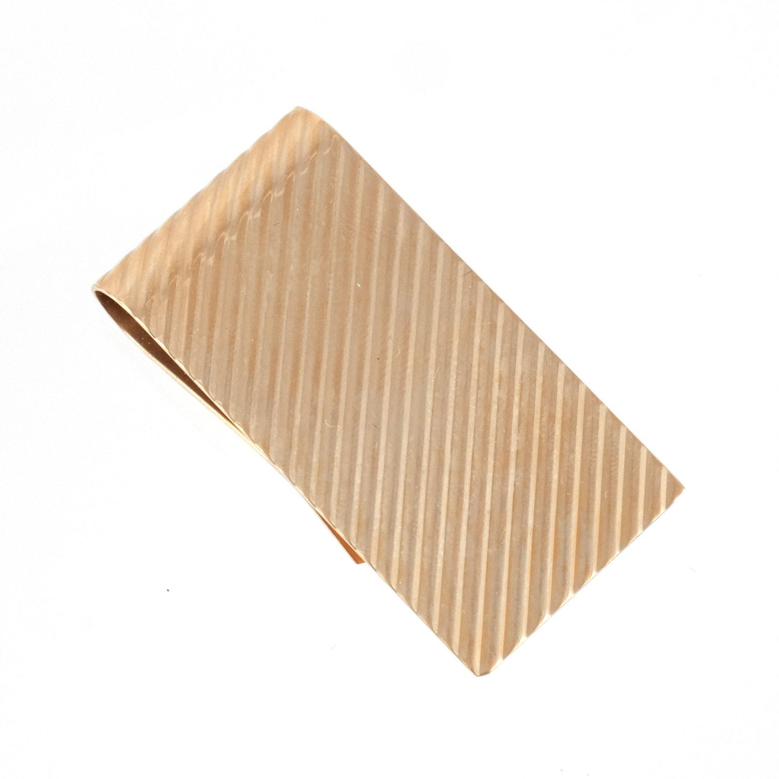 TIFFANY & CO. 14K GOLD MONEY CLIP: Fluted gold, marked 'Tiffany & Co. / 14K', 20.7 g, with original Tiffany box h. 2 w. 1 in. Provenance: The estate of a noted architect and bibliophile, Rye, NY