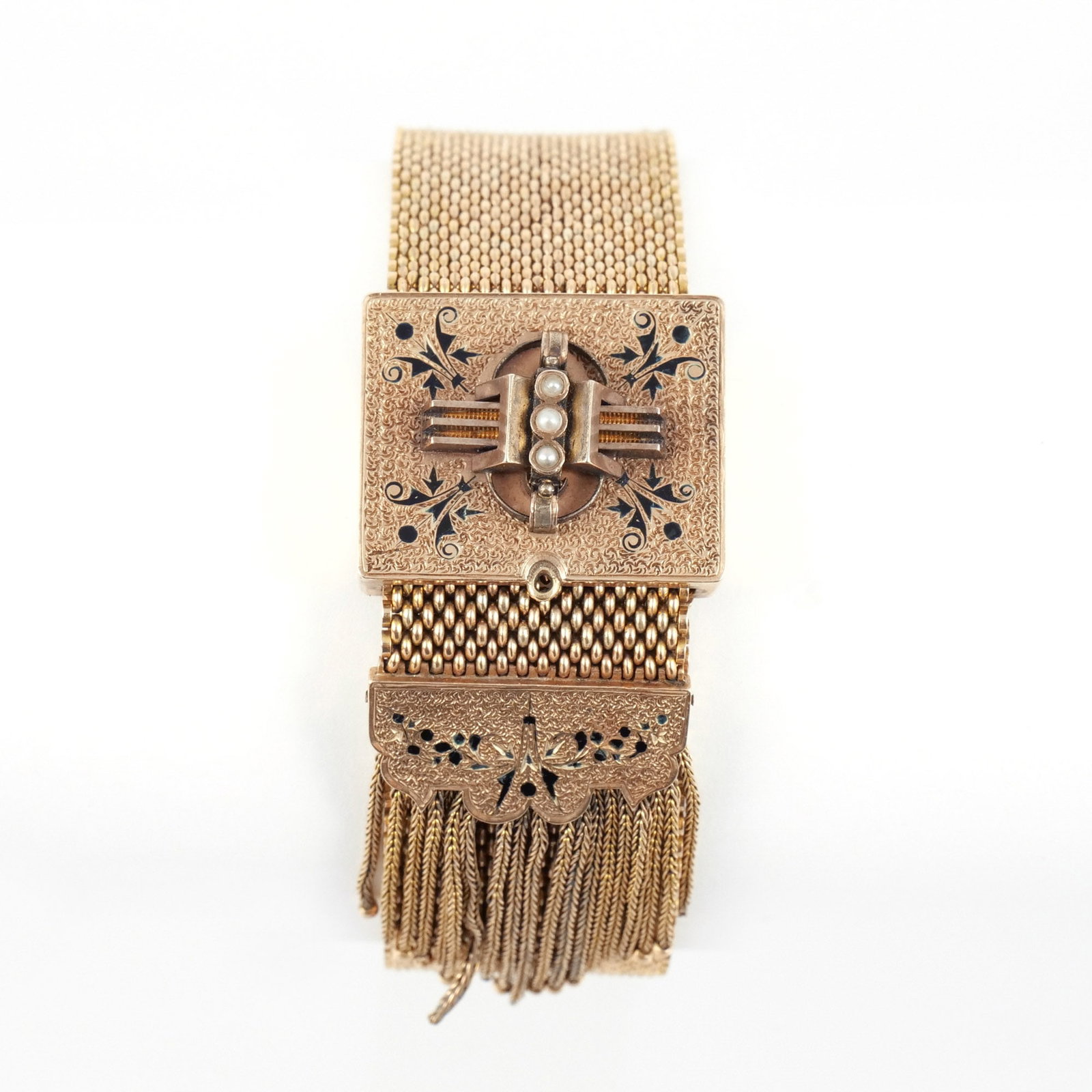 VICTORIAN 14K GOLD TASSEL BRACELET: Sliding clasp and terminal with black enamel and seed pearl decoration on a wide mesh bracelet, 9-1/4 in. maximum interior circumference, clasp w. 1-1/4 in, unmarked but tests as 14k, 70.8 g total wei