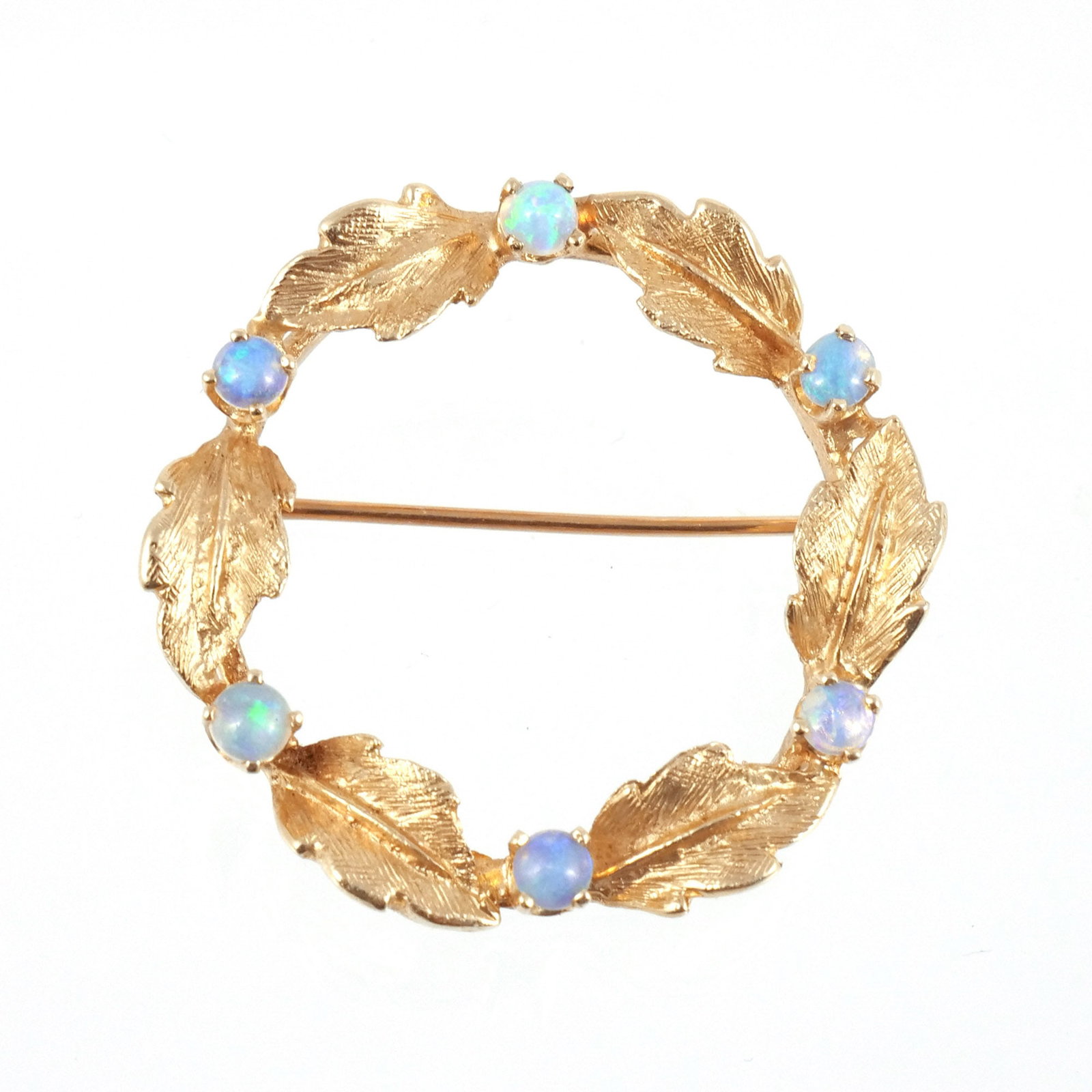 KARBRA 14k GOLD & OPAL WREATH BROOCH: The wreath of florentine finish gold leaves and round opals, signed 'Karbra (c) 66' and marked '14K', 7.2 g total weight dia. 1-1/4 in. Provenance: Descent through the family of the current owner, Pou