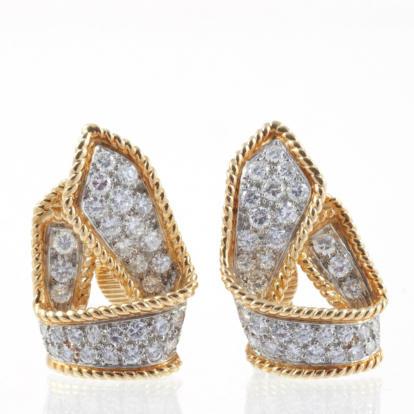 PAIR of 14K GOLD & DIAMOND RIBBON FORM EAR CLIPS: Inset with approx. 3 cts total round diamonds set in white gold and surrounded with a border of rope-form yellow gold, marked '14K', 20 g total weight h. 1-1/8 w. 3/4 in. Provenance: Descended through