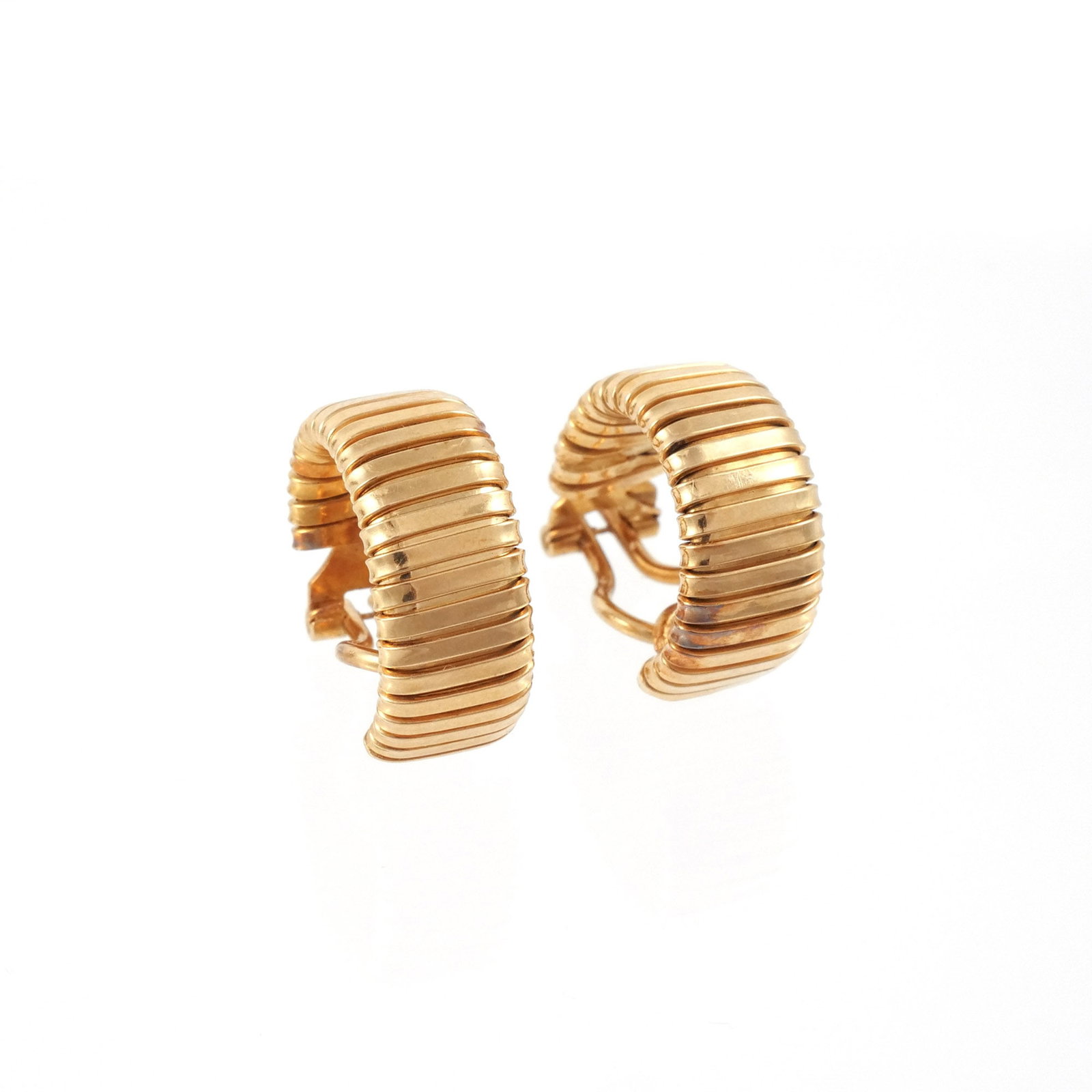 18K ITALIAN GOLD TUBOGAS EAR CLIPS: Flexible half hoops in the style of Bulgari, marked '750' and with Italian registration number '740 VI' for Essepi, 13.8 g total weight h. 3/4 in.
