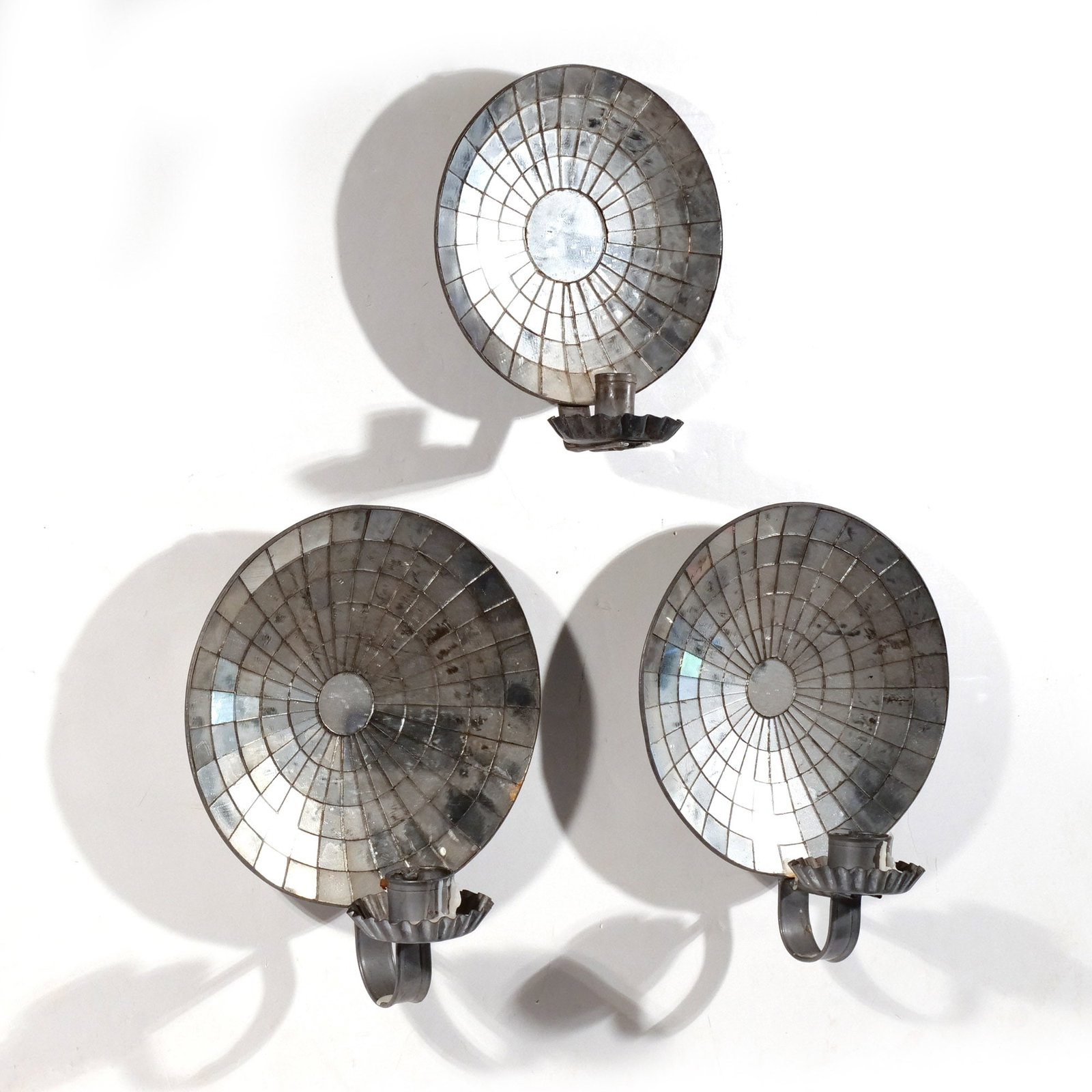 (3pc) ANTIQUE MIRRORED REFLECTOR SCONCES: Late 19th / early 20th century, tin and glass, including one pair and a single h. 11 w. 9 d. 6 in. Provenance: Private collection, Bernardsville, NJ [In Situ Item] This item will not be on display in 