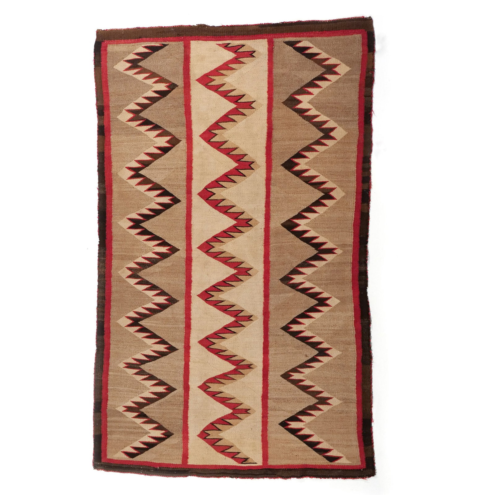 NAVAJO 'LIGHTNING' RUG: Early 20th century, with three vertical, serrated, zig-zag or 'lightning' bands on white and beige reserves h. 5 ft. 3 in. w. 3 ft. 3 in. Provenance: Private collection, Bernardsville, NJ