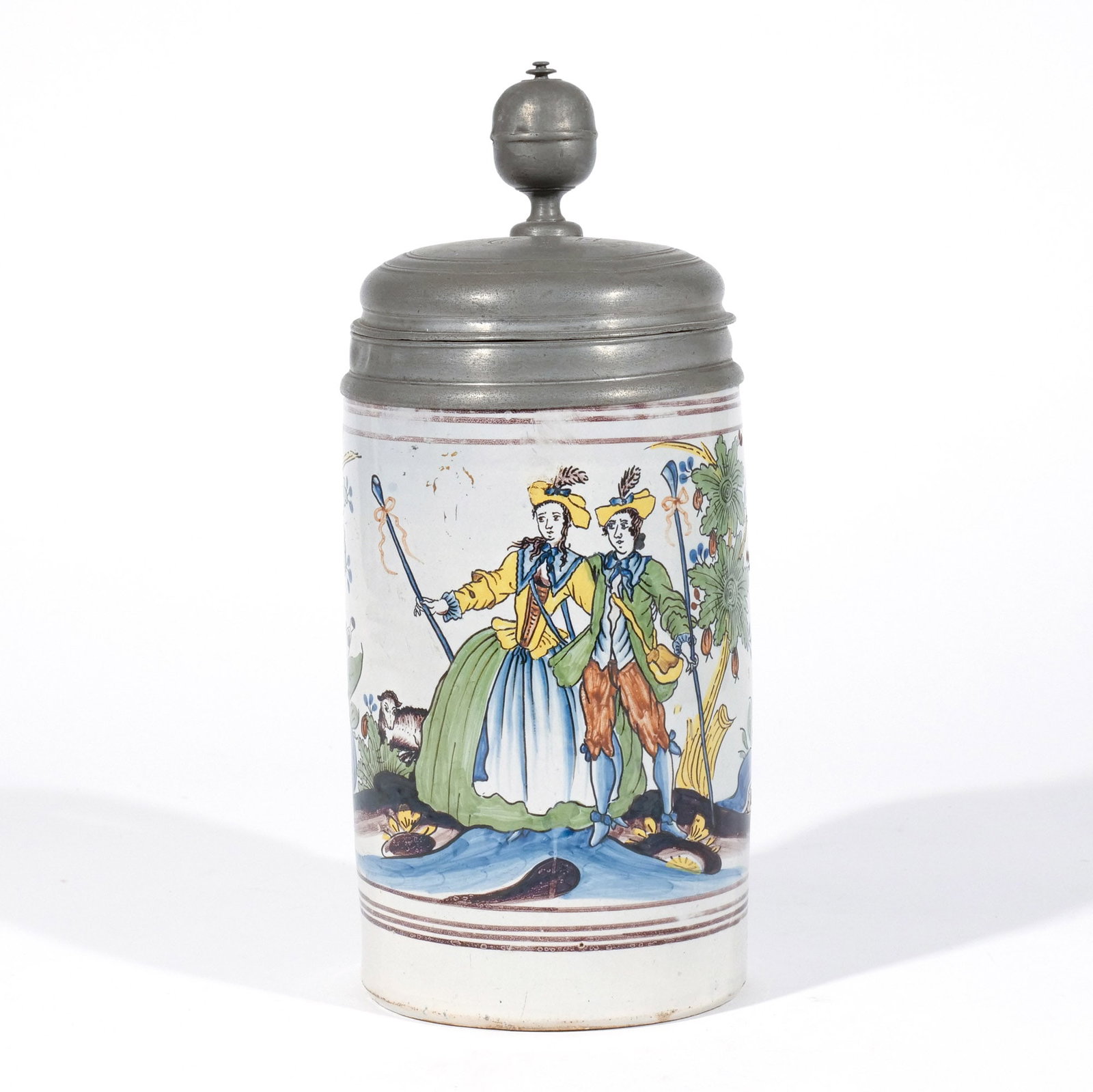 GERMAN FAIENCE WALZENKRUG STEIN with COUPLE: Likely Erfurt-Thuringia, 18th century, decorated with a shepherd couple, pewter cover and base, with hallmarks h. 11 in. Provenance: The estate of a noted architect and bibliophile, Rye, NY