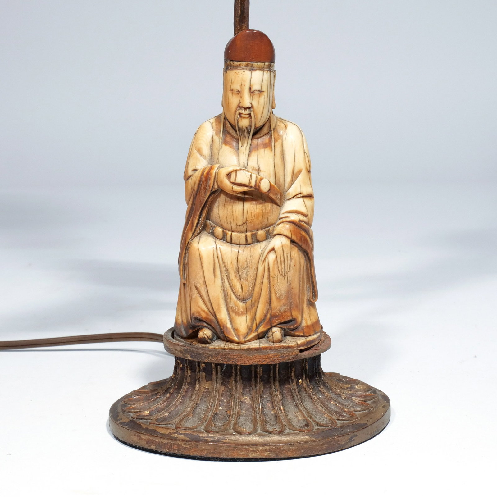 CHINESE CARVING & JADE FINIAL: Ming dynasty, depicting the Taoist immortal Zhang Guolao, mounted as lamp with pale celadon finial h. 21 w. 6 d. 5 in. (largest) Provenance: The estate of Richard and Jean M. Bergstresser, owner of th