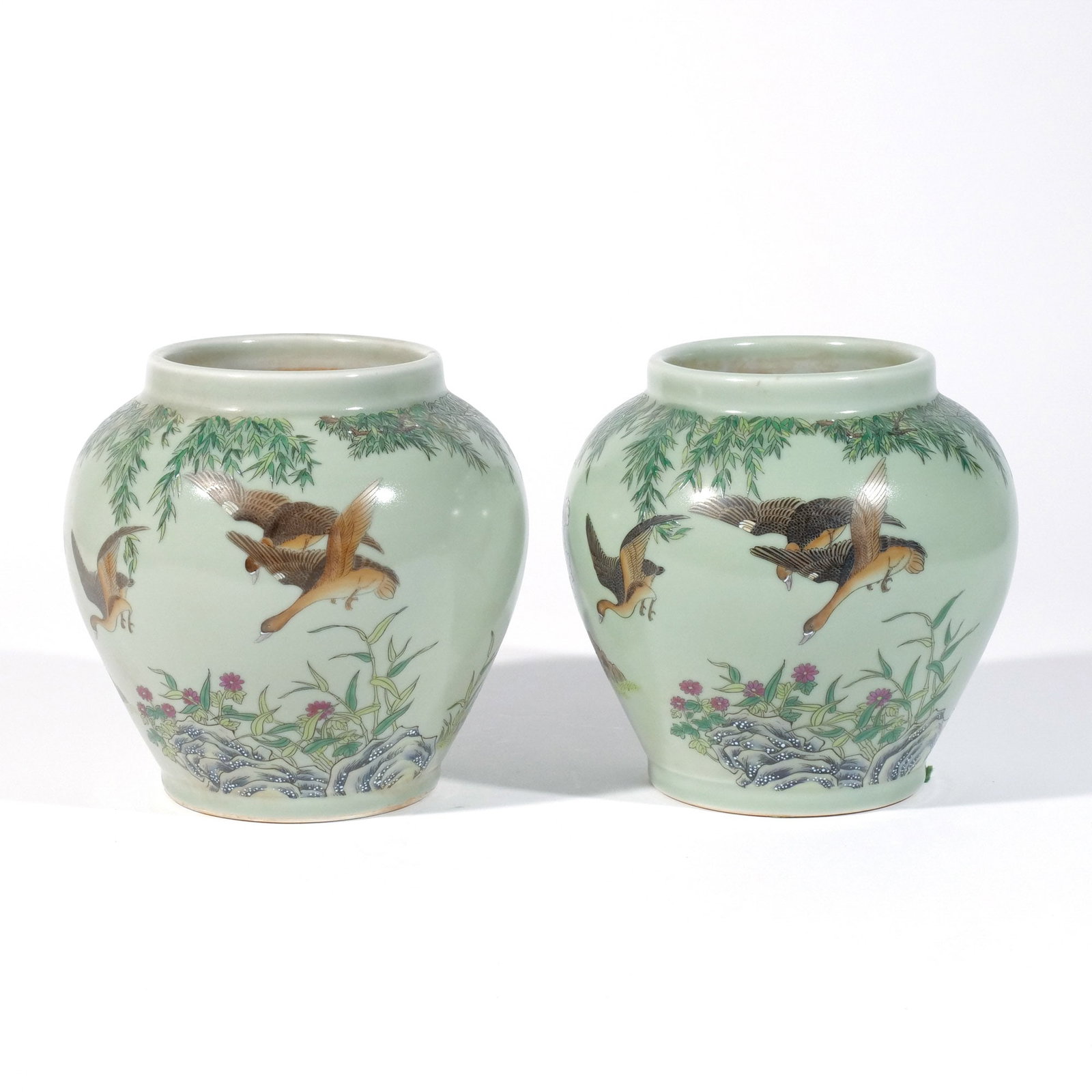 PAIR of CELADON FAMILLE ROSE PORCELAIN VASES: 20th century, Chinese or possibly Japanese, with enamel decoration of ducks on a celadon ground, with apocryphal Qianlong reign marks h. 7-1/4 in. dia. 7 in. Provenance: Private collection, Mount