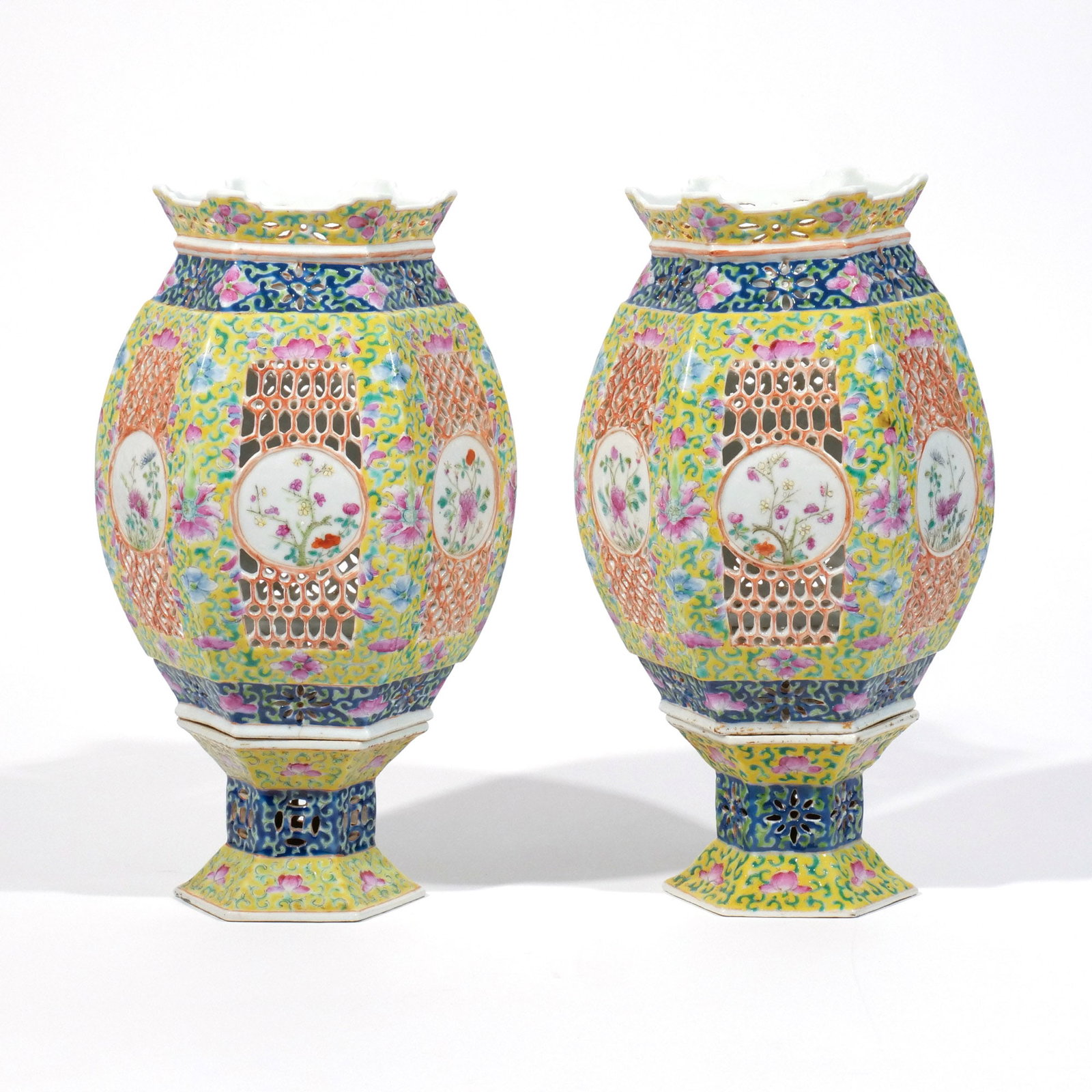PAIR CHINESE RETICULATED PORCELAIN LANTERNS: Early 20th century, decorated in famille rose enamels on a yellow ground h. 12 w. 6-1/2 in. (approx.) Provenance: The estate of noted artist and author Edward Giobbi (1926-2026), Katonah, NY [In Situ