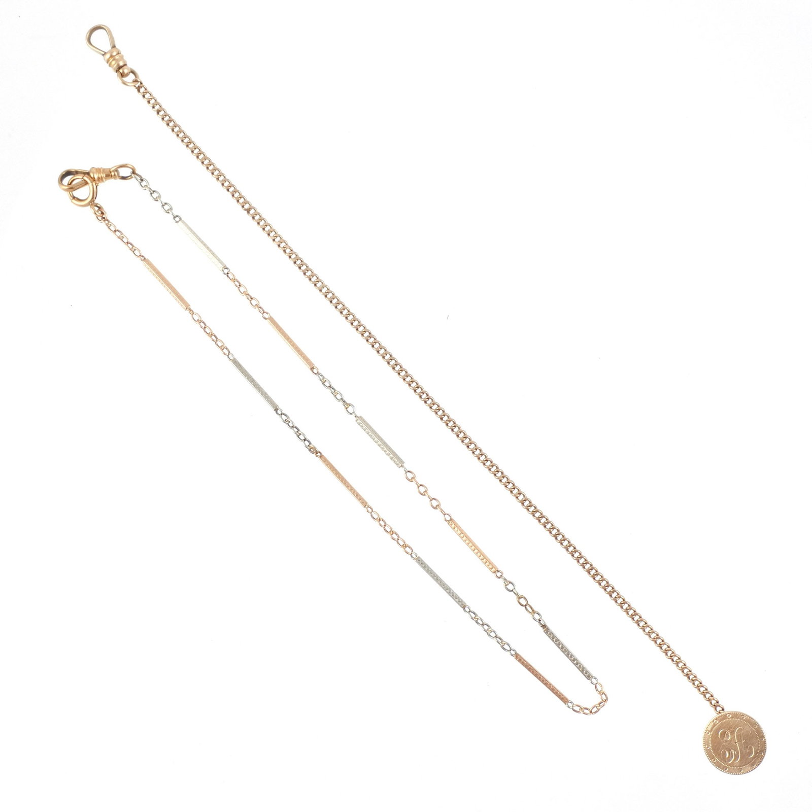 (2pc) 14K GOLD WATCH FOBS: Including a two-tone white and rose gold fob and a yellow gold gob with monogrammed charm, 14.6 g total weight h. 15 in. (longest) Provenance: The estate of a noted architect and bibliophile, Rye, NY