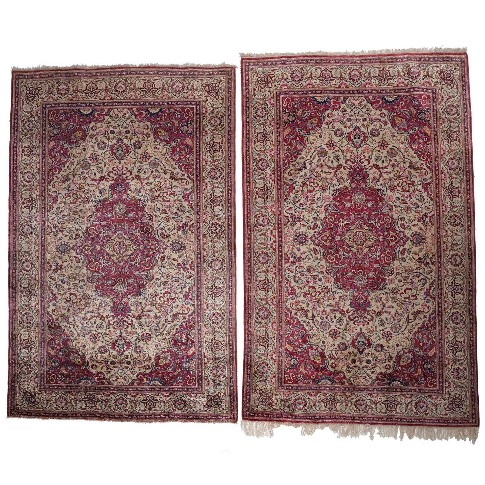 FINE PAIR of KASHAN SILK RUGS: Early-mid 20th century, each with a red medallion and spandrels on a white ground, with sickle-leaf arabesque patterns h. 6 ft. 9 in. w. 4 ft. 5 in. (each) Provenance: Private collection, Mount