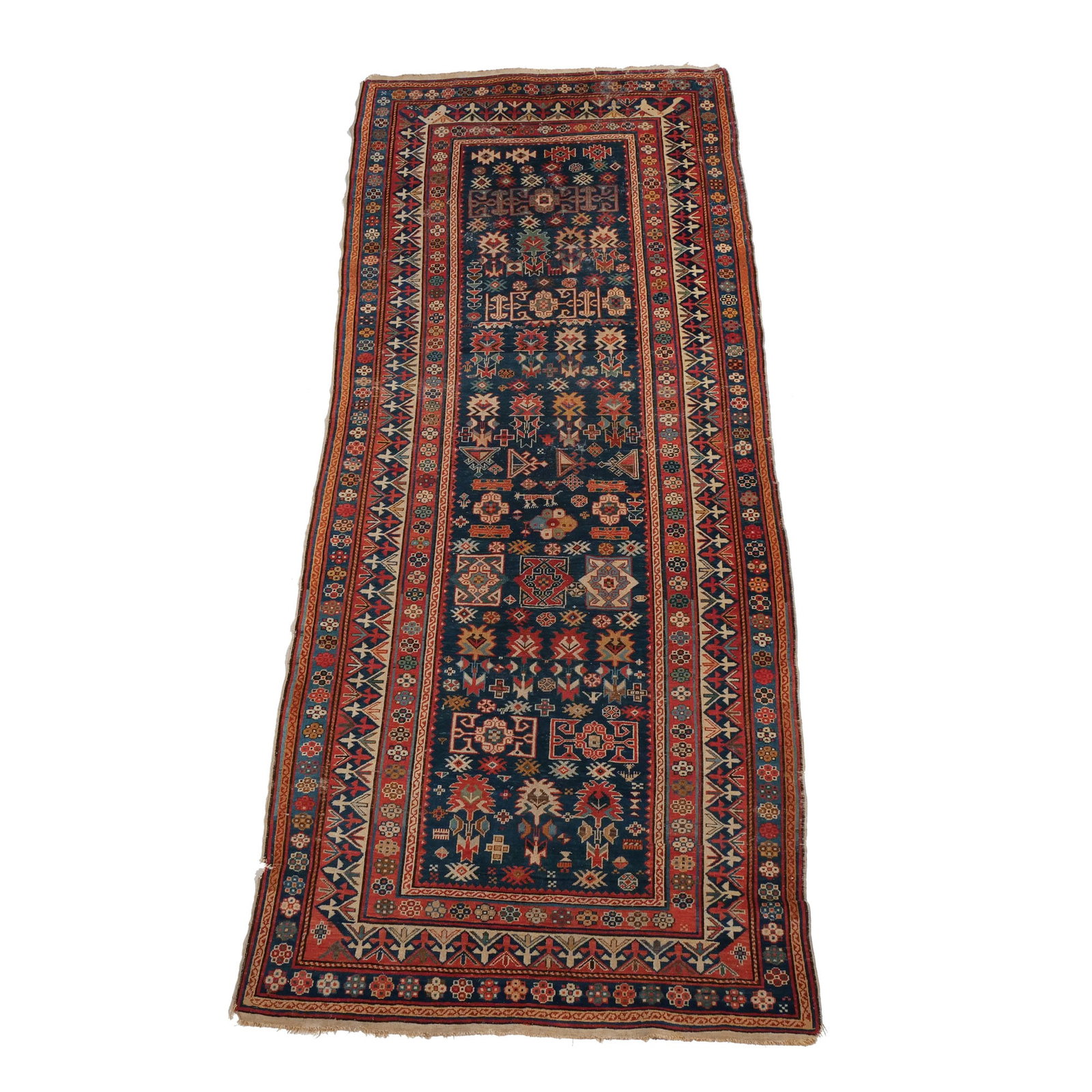 ANTIQUE SHIRVAN / CAUCASIAN LONG RUG: Late 19th / early 20th century h. 9 ft. 3 in. w. 3 ft. 10 in. Provenance: The estate of Richard and Jean M. Bergstresser, owner of the Laurence McGuire House, historic landmark, Greenwich, CT