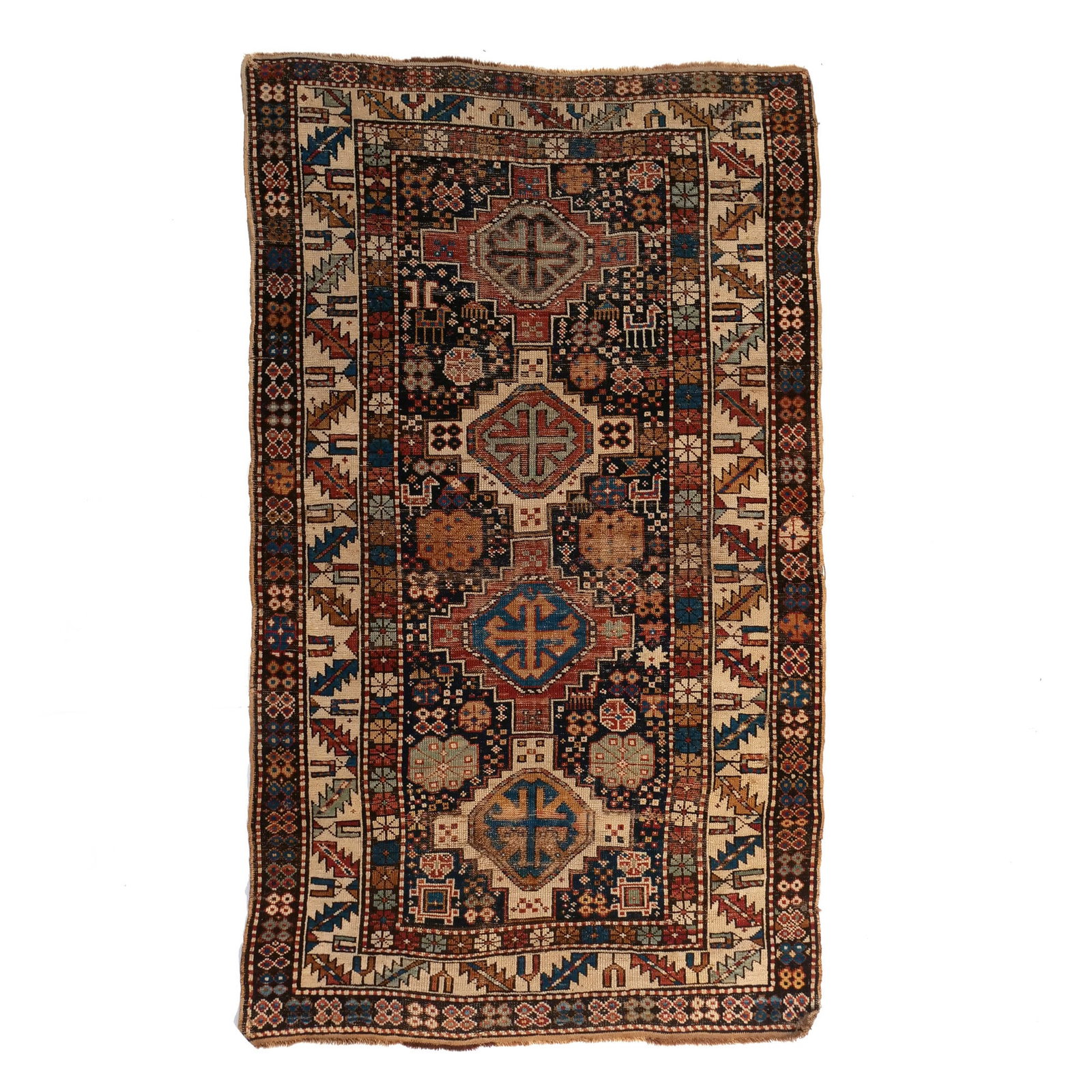 SHIRVAN RUG: Caucus, late 19th century, having four stepped geometric medallions on an indigo ground surrounded by white meander-vine borders, all natural dyes h. 5 ft. 9 in. w. 3 ft. 5 in. Provenance: Private