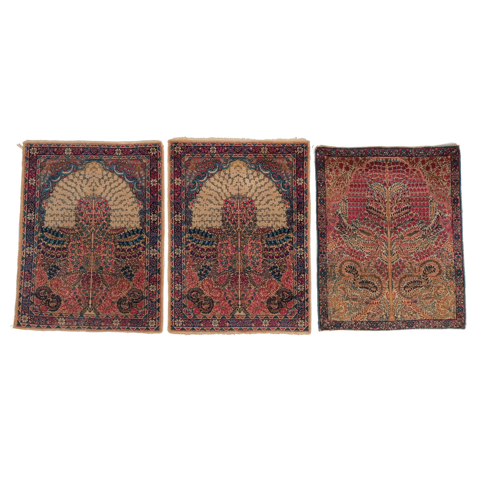 (3pc) RARE PAIR of KERMAN MATS: Early 20th century, having a butterfly design of small size, with mihrabs, plus a third Kerman mat h. 2 ft. 10 in. w. 2 ft. 1 in. (largest) Provenance: The estate of Richard and Jean M. Bergstresser,