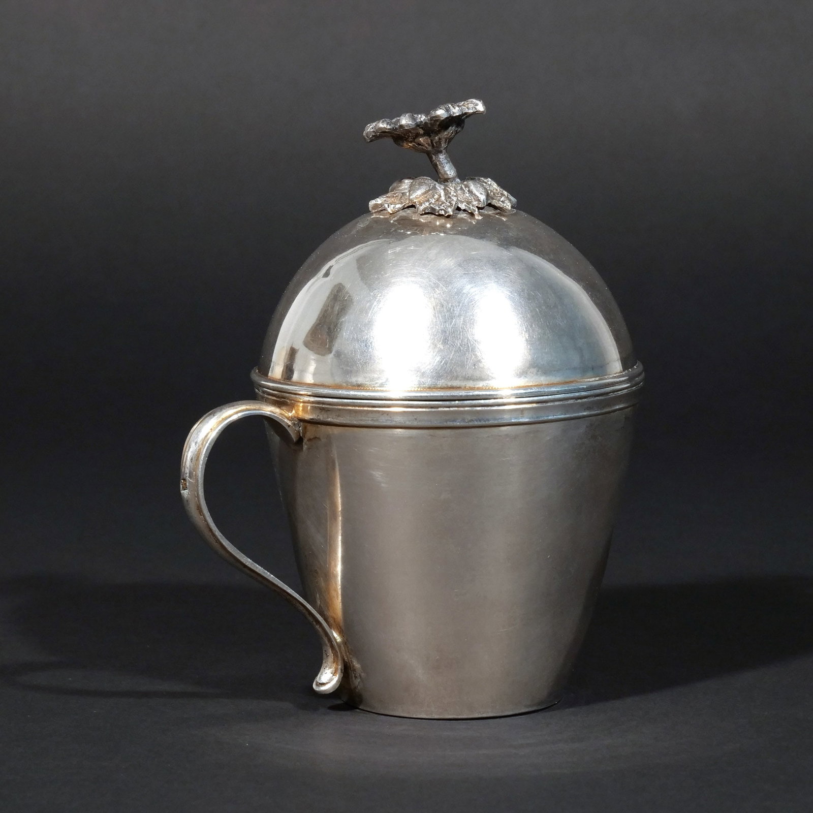 EGYPTIAN SILVER COVERED VESSEL: Cairo, pre-1916, with a chased floral finial, 13 ozt h. 6 w. 5 d. 4 in. Provenance: The estate of Richard and Jean M. Bergstresser, owner of the Laurence McGuire House, historic landmark, Greenwich,