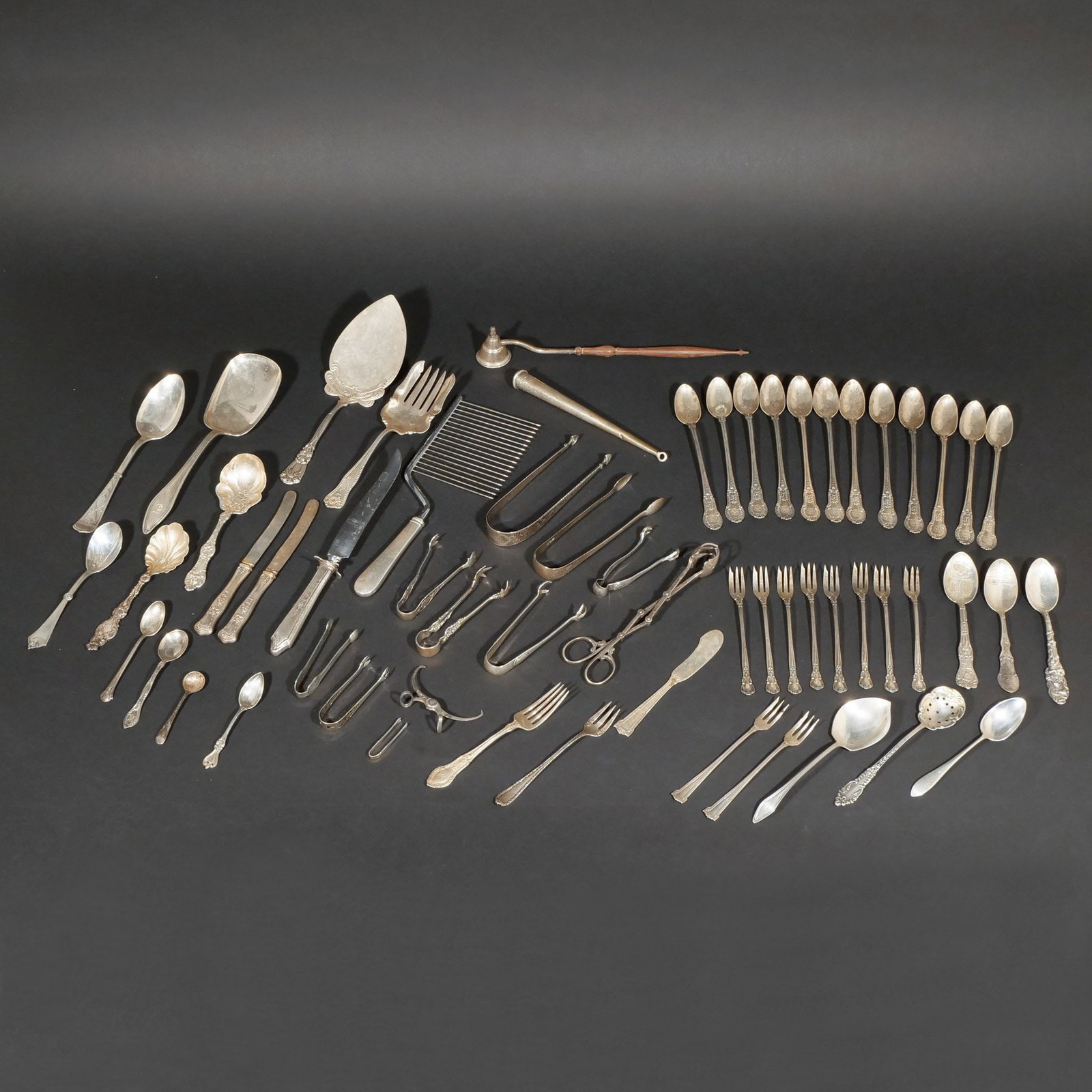(59pc) STERLING SILVER FLATWARE AND OTHER: Including 8 misc. serving pieces, 4 salt/sugar spoons, 5 teaspoons, 12 iced tea spoons, 8 olive forks, 3 misc. olive forks, 1 dessert fork, 10 misc. tongs, 1 extending ice cube tongs, 1 butter knife, 