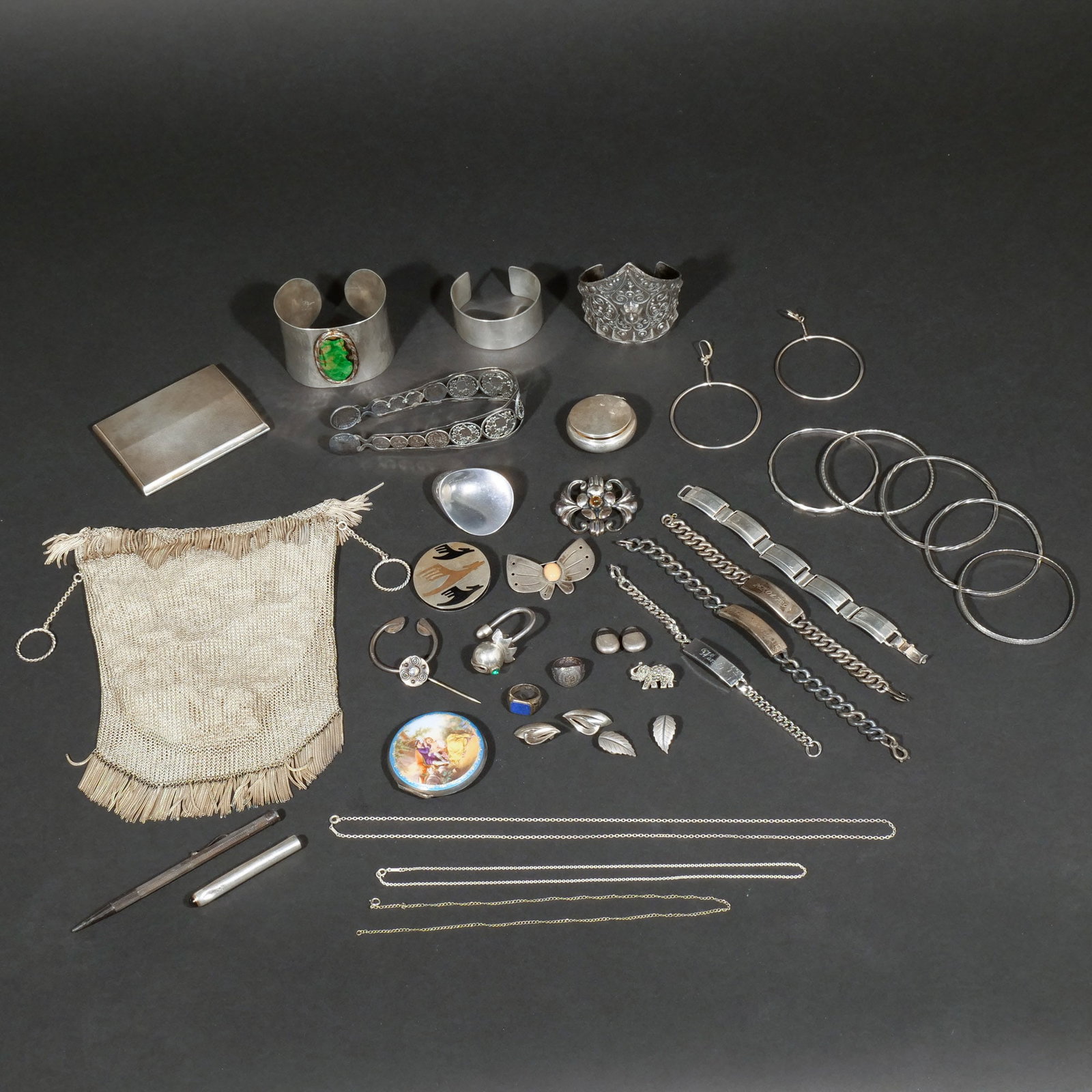 (39pc) LARGE GROUP OF SILVER JEWELRY AND OTHER: Including a Kurt Jobst hammered sterling silver cuff with green stone, a Peruzzi sterling silver cuff with filigree decoration, a plain sterling silver cuff, a Georg Jensen triangular-shaped sterling 
