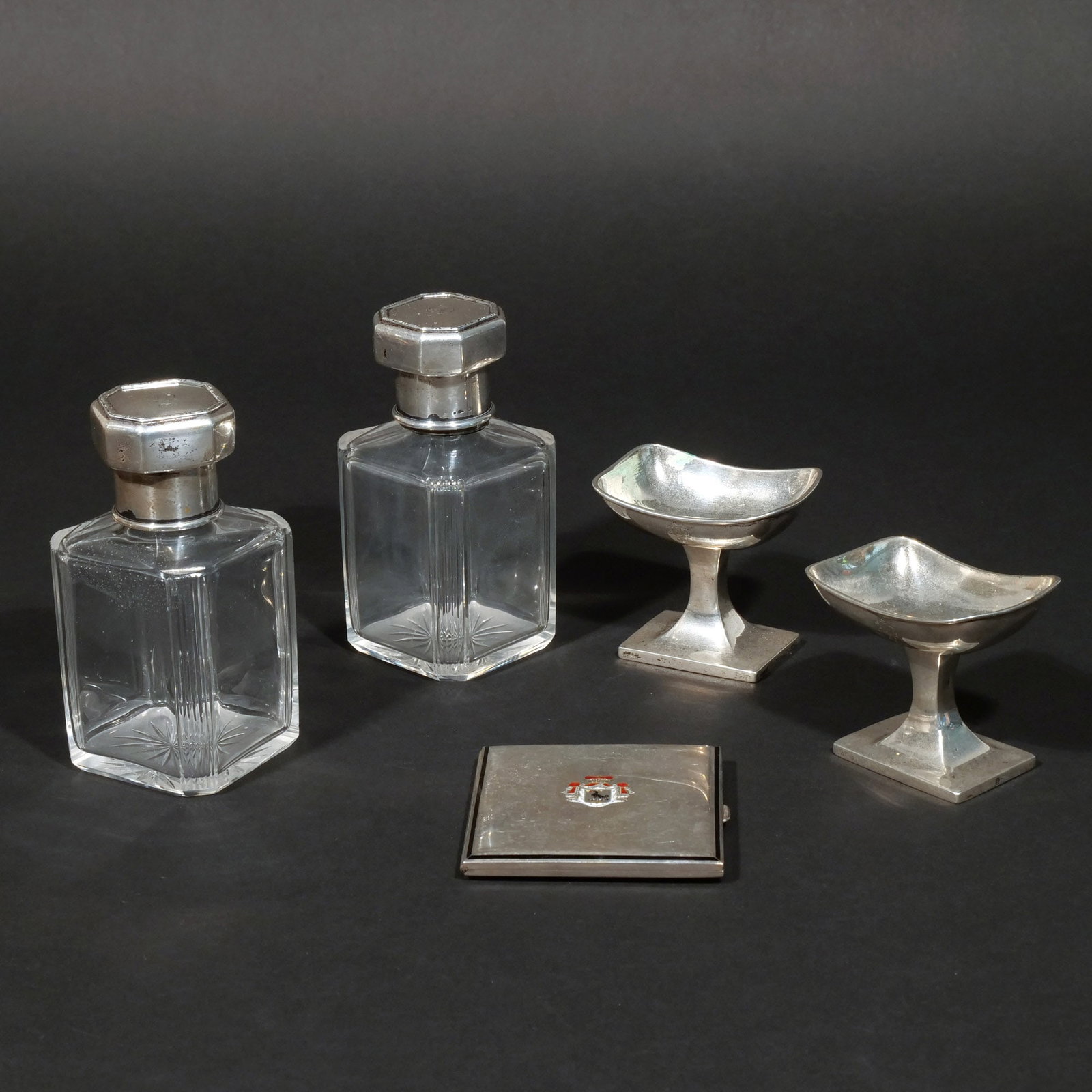(5pc) MISC. SILVER ARTICLES: Including 2 small .800 silver compotes, a .900 silver cigarette case with gilt interior, and 2 cut glass decanters with .800 silver caps; 12.7 ozt total weighable h. 5 w. 2-1/2 d. 2-1/2 in. (largest)