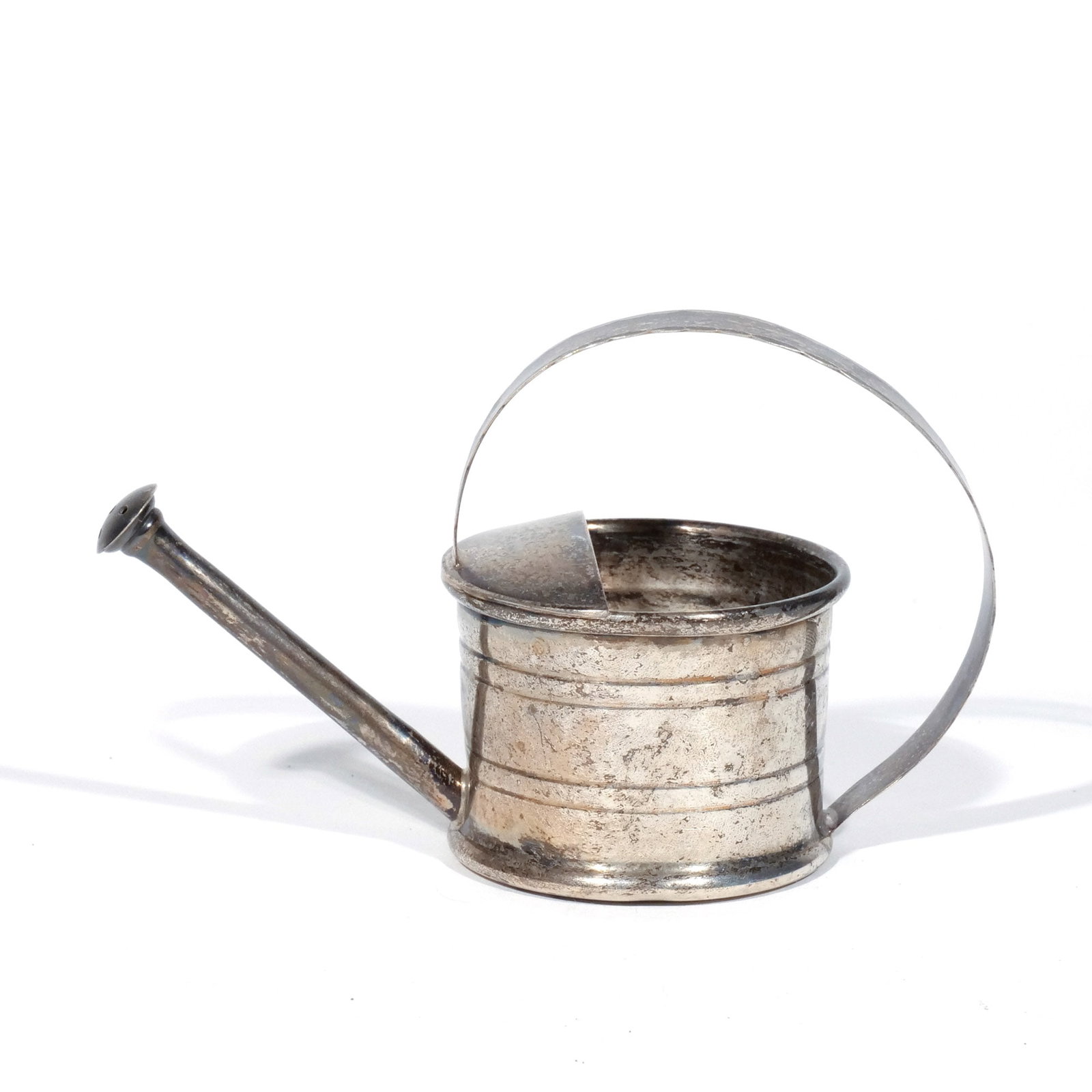 CARTIER STERLING SILVER WATERING CAN: Signed 'Cartier' and marked 'Sterling', 1.5 ozt h. 3 w. 5 d. 2-1/4 in. Provenance: Descent through the consignor's family [In Situ Item] This item will not be on display in our saleroom during our
