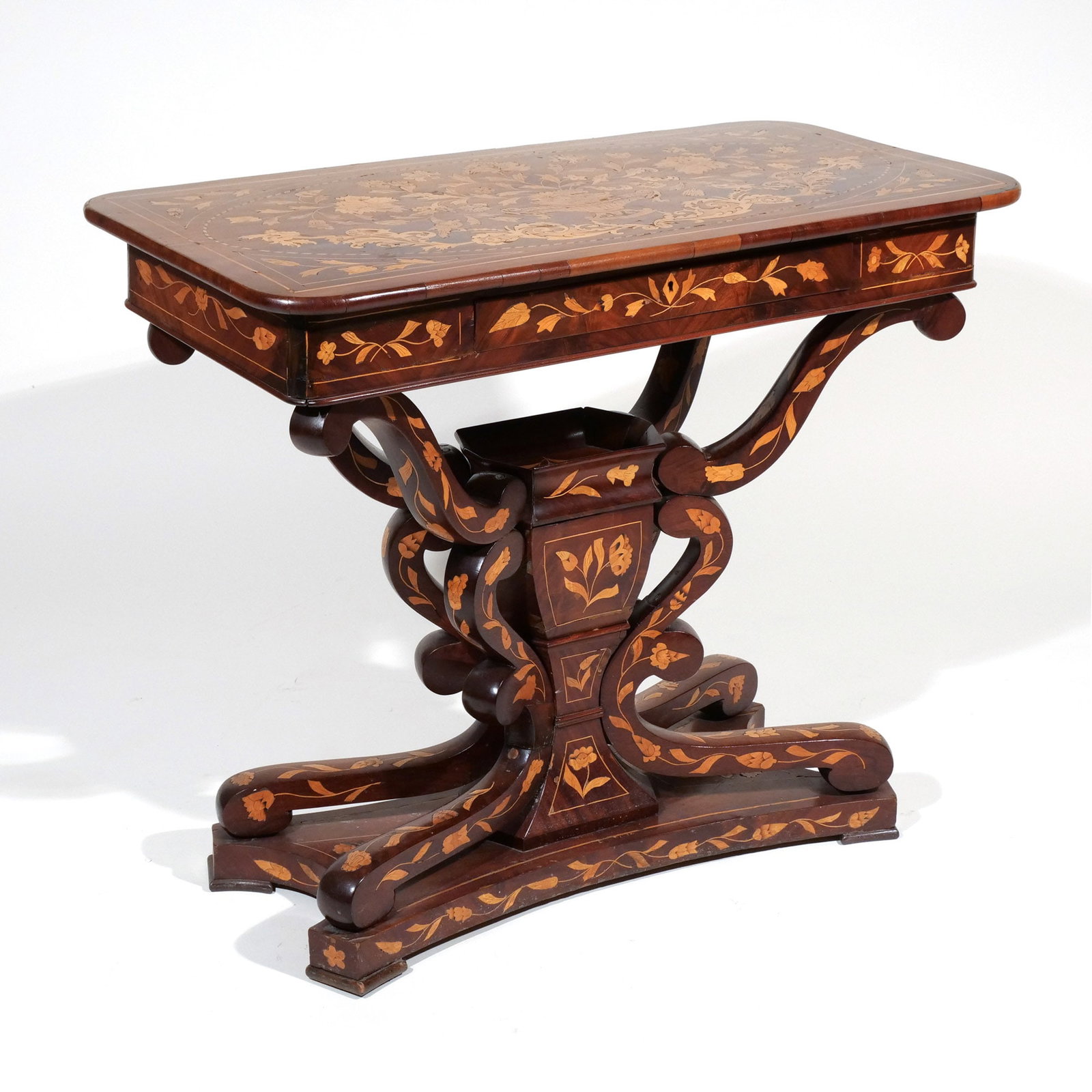 DUTCH MARQUETRY PEDESTAL BASE CENTER TABLE: 19th century, having a single frieze drawer h. 28 w. 34-1/4 d. 17-1/2 in. Provenance: Descent through a prominent Manhattanite's estate [In Situ Item] This item will not be on display in our saleroom 