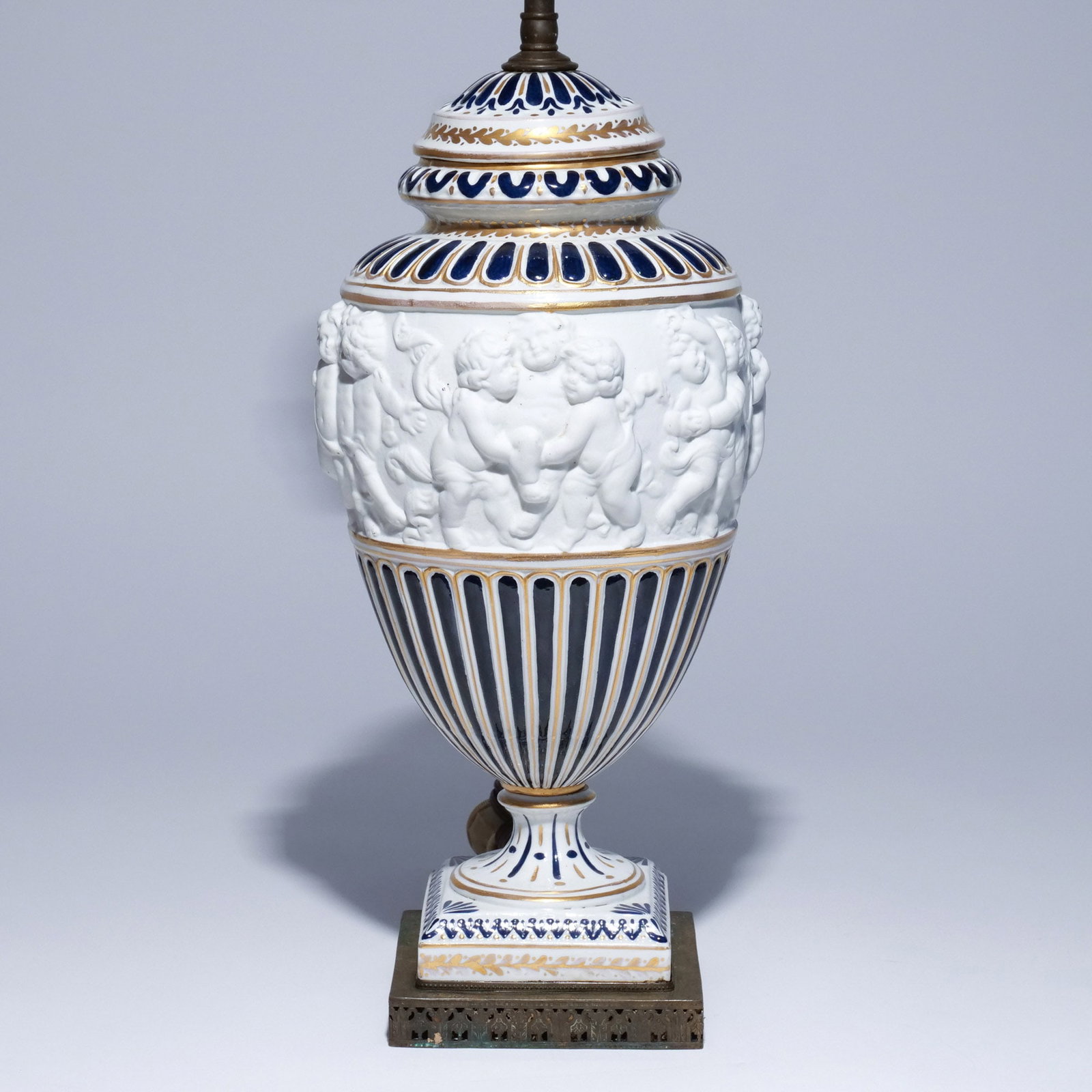 19th C. 'SEVRES' PORCELAIN & BISCUIT COVERED JAR: With molded putti decoration, mounted as a lamp h. 15 in. (jar) overall: h. 26 in. (overall) Provenance: Property of a Hartsdale, NY lady [In Situ Item] This item will not be on display in our saleroo