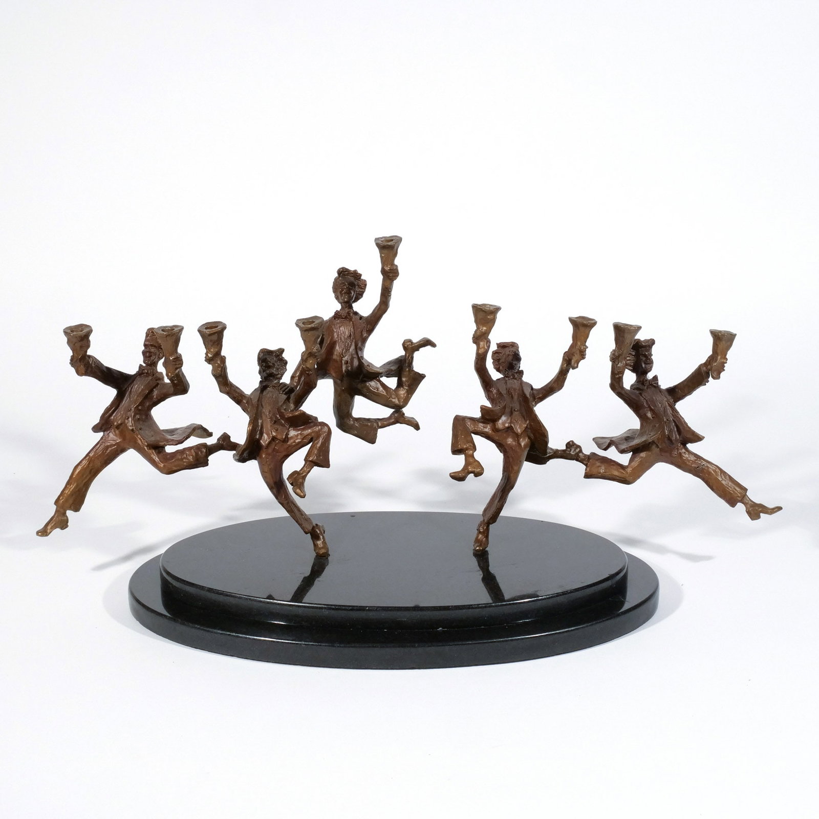ZACHARY OXMAN (American, b. 1968) MENORAH: Dancing Men Festival of Light, bronze on a marble base h. 11 w. 22-1/2 d. 10 in. Provenance: Private collection, Mount Kisco, NY [In Situ Item] This item will not be on display in our saleroom during 