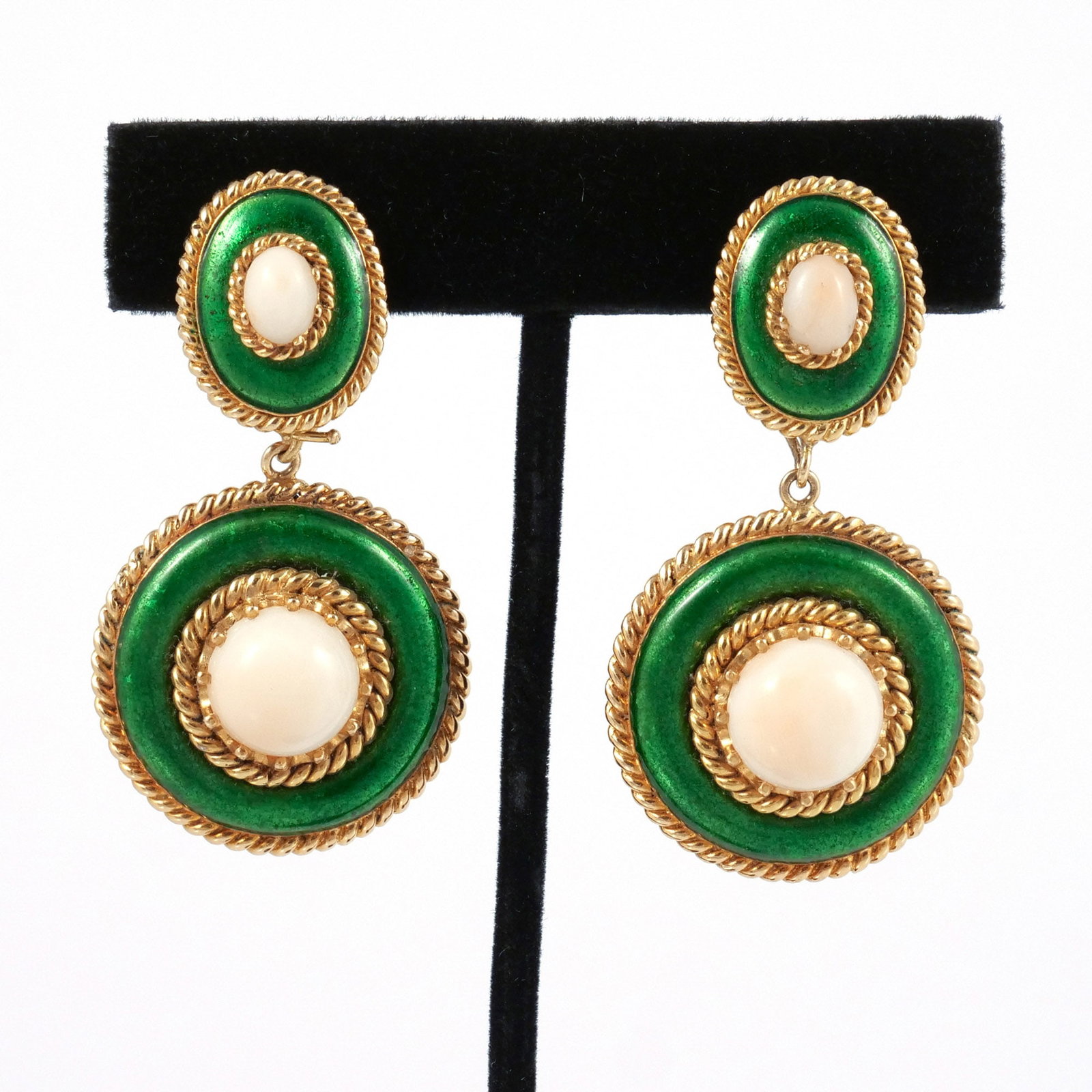 PAIR 18K GOLD, ENAMEL, & CORAL PENDANT EAR CLIPS: Oval studs with round pendant drops composed of deep green enamel and pale center coral cabochons surrounded by gold rope trim, marked '750 GMS / 18k', 34.7 g total weight h. 2 in. Provenance: Descend
