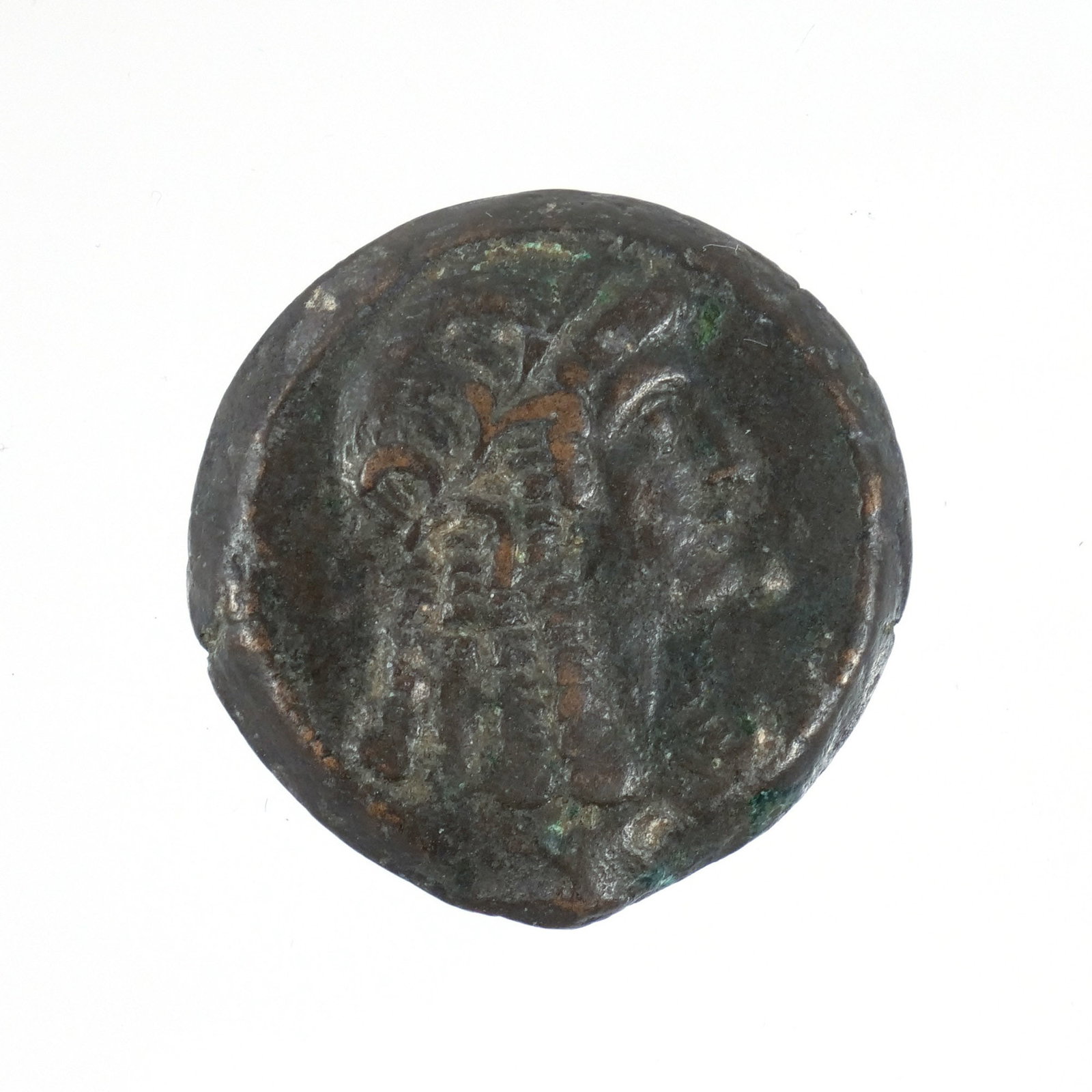PTOLEMAIC BRONZE COIN: Possibly 1st / 2nd century BC, likely depicting Cleopatra I as Isis dia. 1 in. Provenance: Descent through a prominent Manhattanite's estate