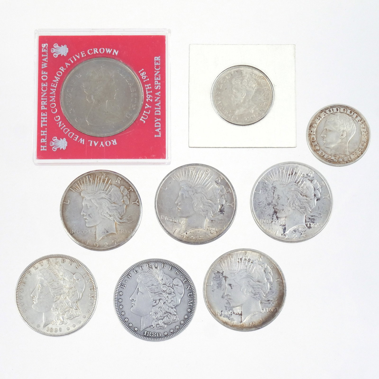 (9pc) MOSTLY SILVER DOLLARS AND OTHER COINS: Including 4 Peace silver dollars dated 1924 & 1927, 2 Morgan silver dollars dated 1880 & 1889, a 1958 50 Francs coin, a 1927 George V Australian commemorative florin, and a 25 pence Wedding of Prince 