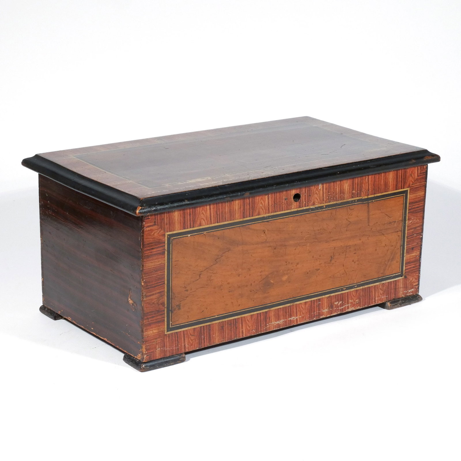 ANTIQUE THREE-BELL CYLINDER MUSIC BOX: Early 20th century, in a wood box with transfer-decorated banding around the edges, no apparent maker's marks, functioning h. 8-1/2 w. 19 d. 11 in. Provenance: The estate of a noted architect and bibl