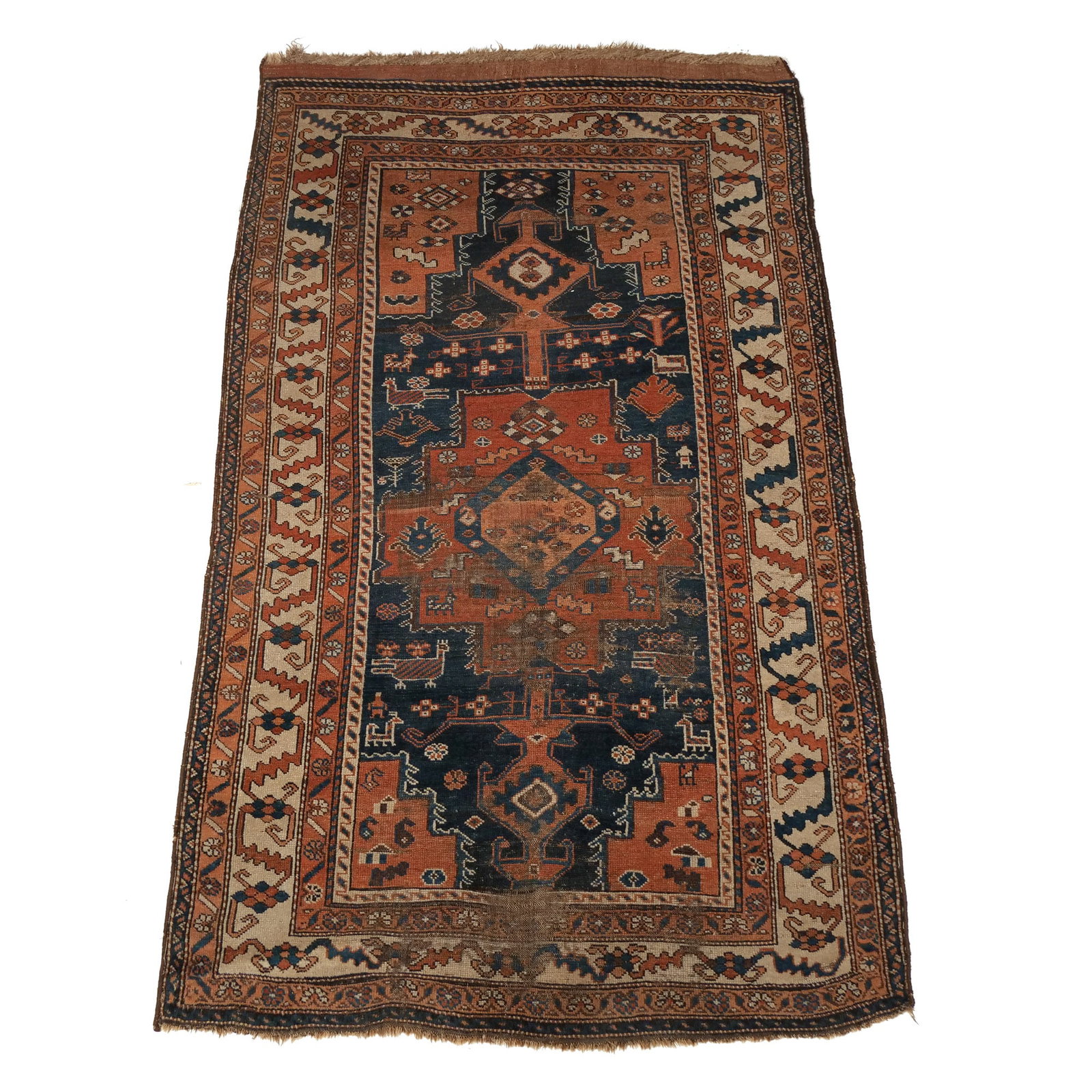 CAUCASIAN RUG: Early 20th century, showing a prominent central medallion h. 8 ft. 10 in. w. 5 ft. 2 in. Provenance: Landmark Hoyt Homestead, Pound Ridge, NY