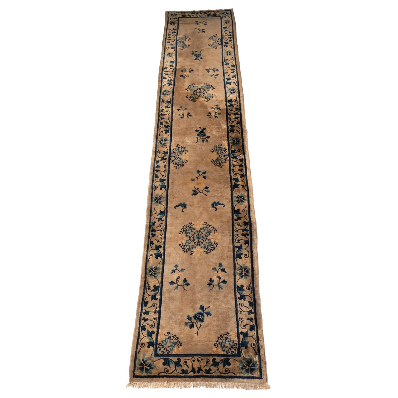 CHINESE PEKING RUNNER: Early 20th century, with sparse floral designs on a white ground, excellent size h. 15 ft. 1 in. w. 3 ft.