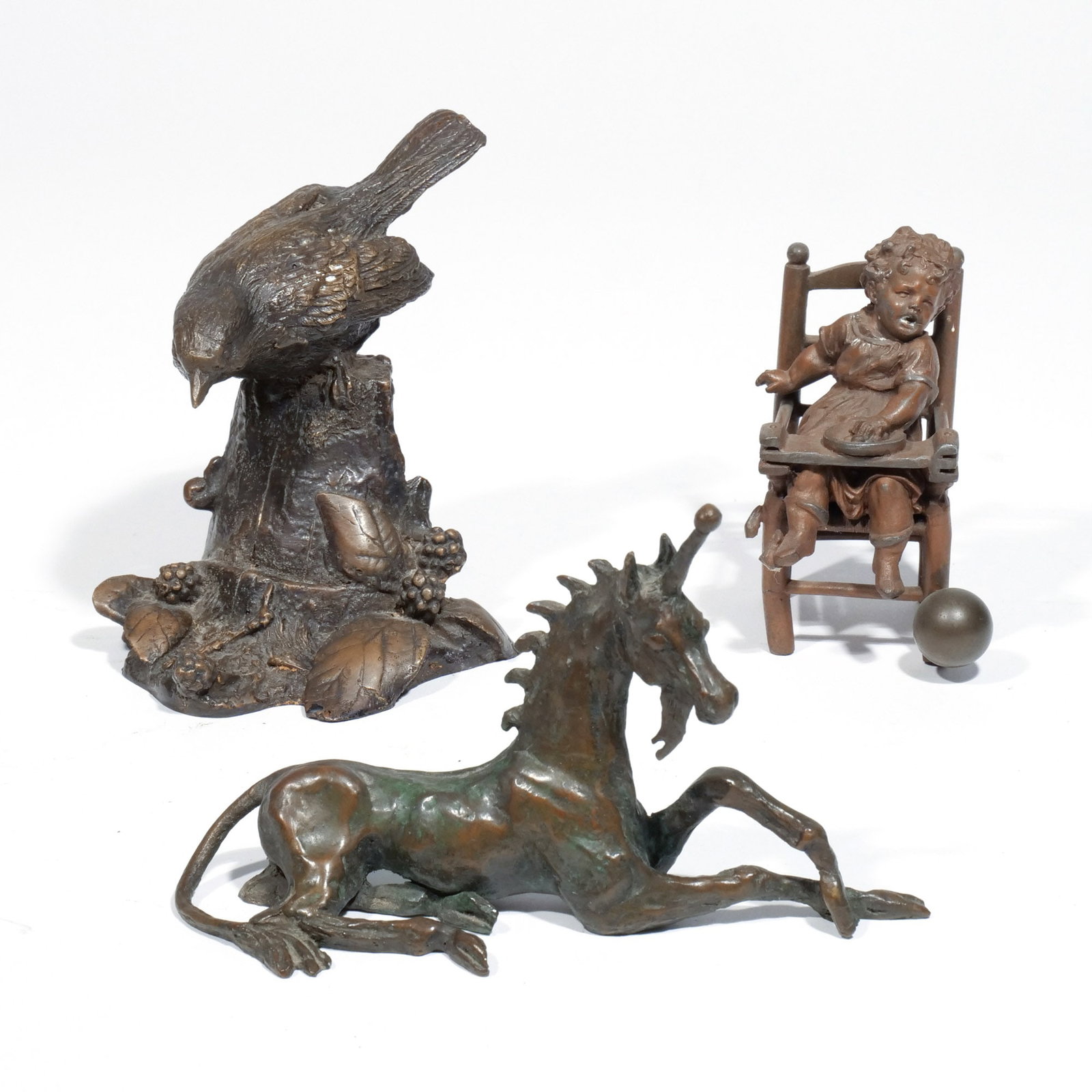 (3pc) BRONZE & METAL FIGURES: h. 5 w. 3-1/2 d. 3-1/2 in. (largest) Including TAUNI De LESSEPS (1920-2001), Unicorn, bronze, limited edition; a bronze figure of a bird on an outcropping; and a Victorian cast metal figure of a child
