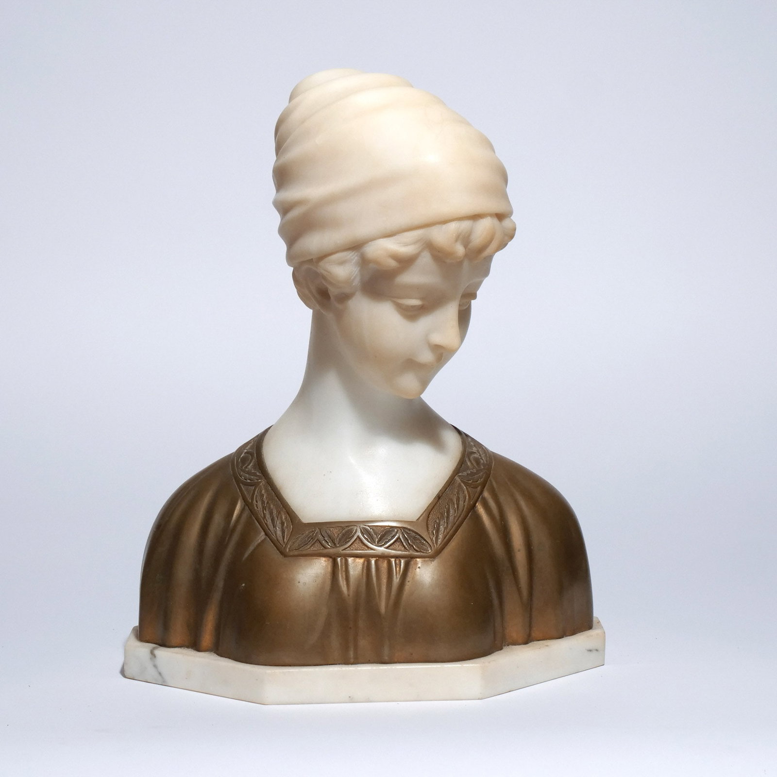 RENE MAQUET (19th / 20th centuries): Bust of Young Lady Alabaster and bronze h. 13 in. Signed Maquet, mounted on marble plinth Provenance: Descent through a prominent Greenwich, CT doctor's estate [In Situ Item] This item will not be on 