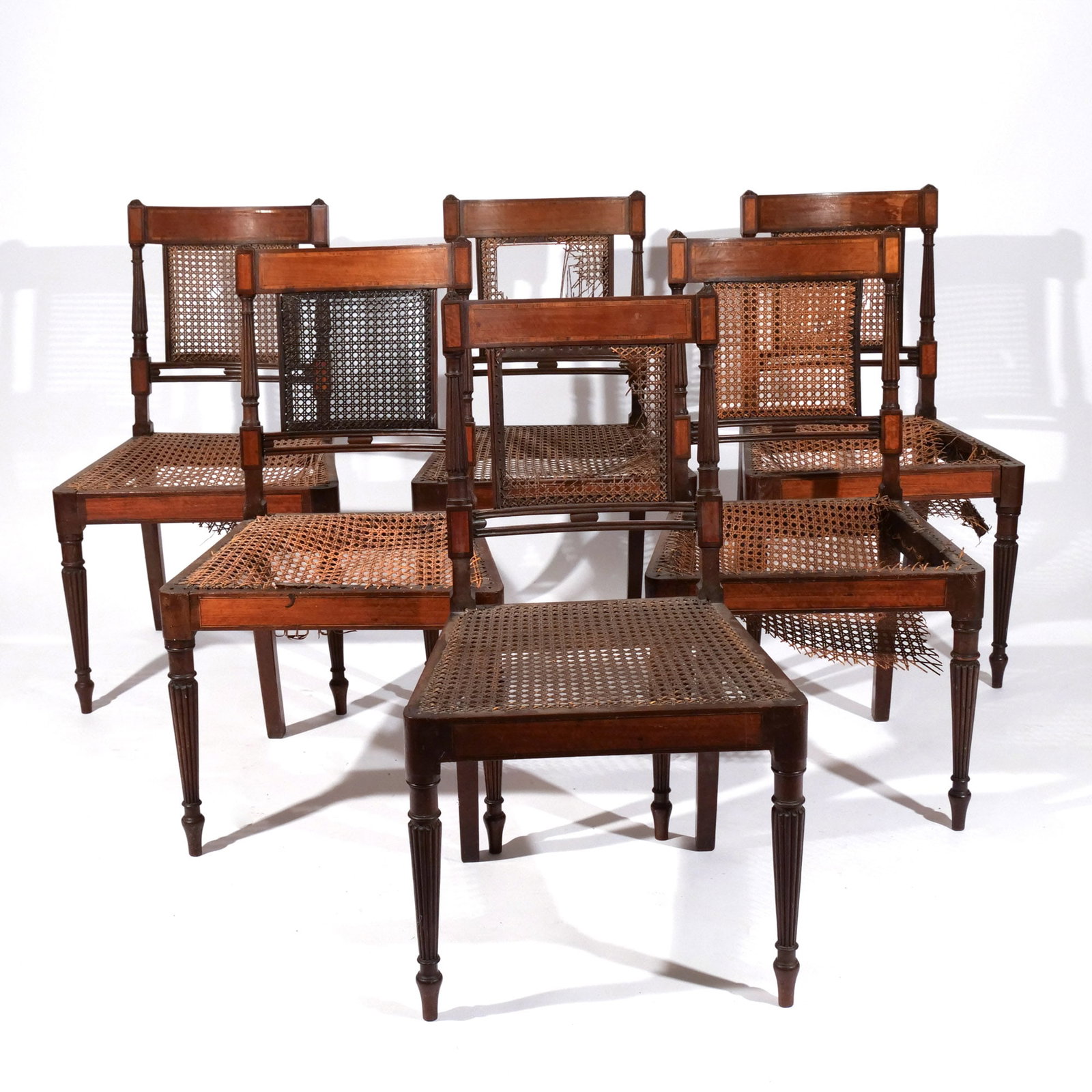 (6pc) LATE FEDERAL INLAID MAPLE SIDE CHAIRS: Early 19th century, with cane seats and backs, seat height 16 in. h. 33-1/2 w. 19 d. 17 in. Provenance: The estate of noted artist and author Edward Giobbi (1926-2026), Katonah, NY [In Situ Item]