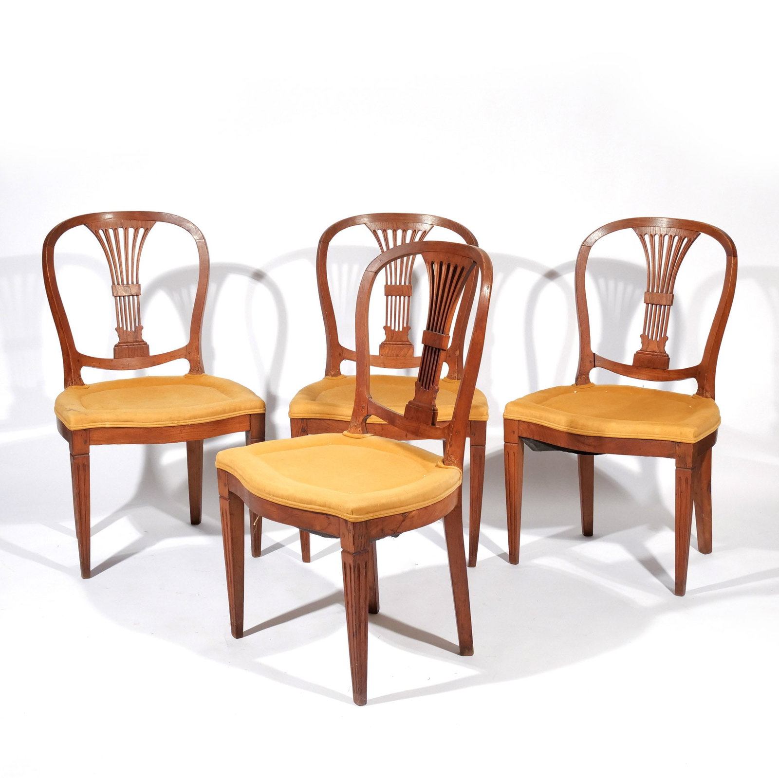 (4pc) HEPPLEWHITE-STYLE WALNUT SIDE CHAIRS: Late 19th / early 20th century h. 17 in. (seat) w. 20-1/2 d. 17 in. overall: 35-1/2 x 20-1/2 x 17 in. Provenance: Descent through a prominent Greenwich, CT doctor's estate [In Situ Item] This item