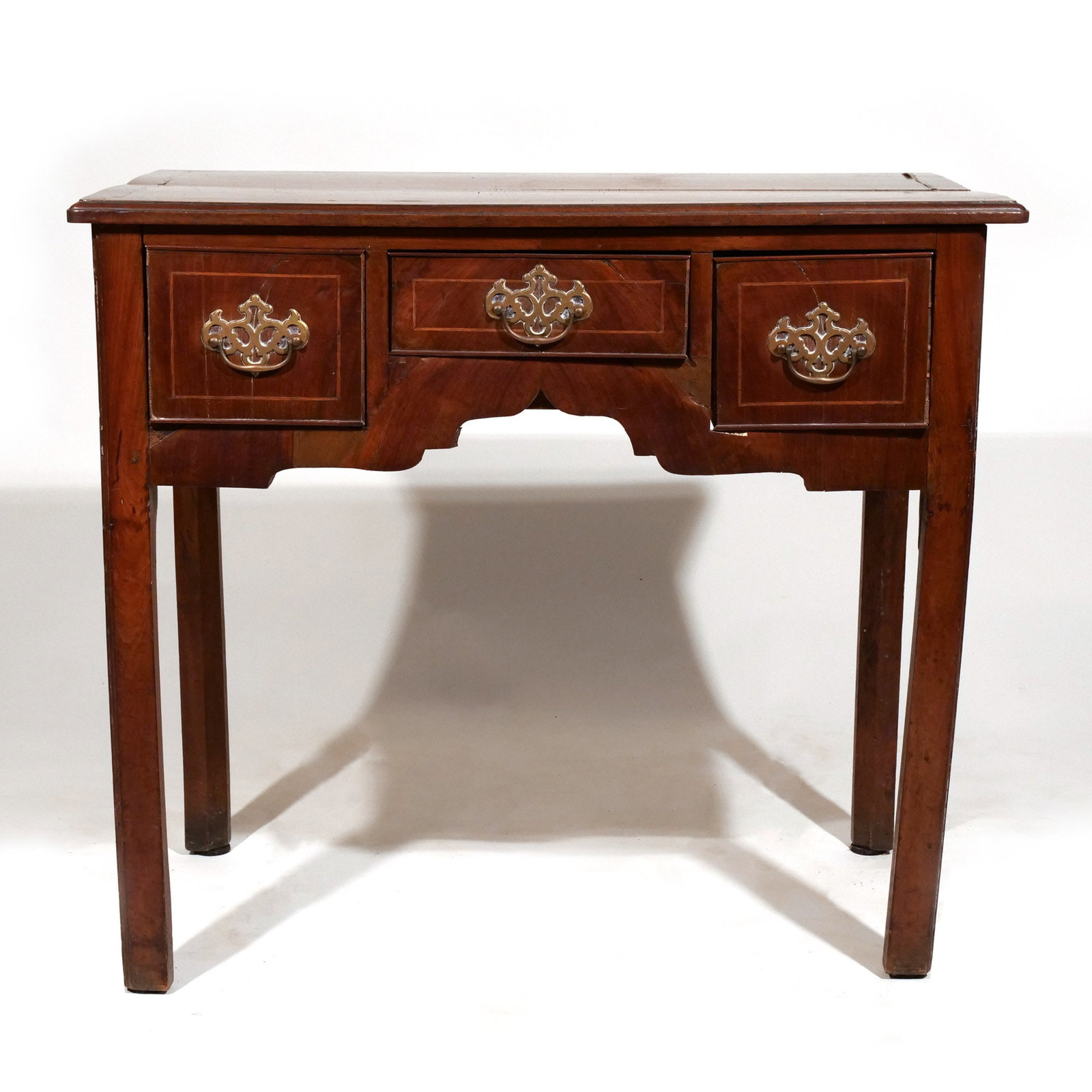 GEORGIAN INLAID MAHOGANY LOWBOY: Having three cock beaded string inlaid drawers h. 28 w. 32 d. 19 in. Provenance: Descent through a prominent Greenwich, CT family [In Situ Item] This item will not be on display in our saleroom