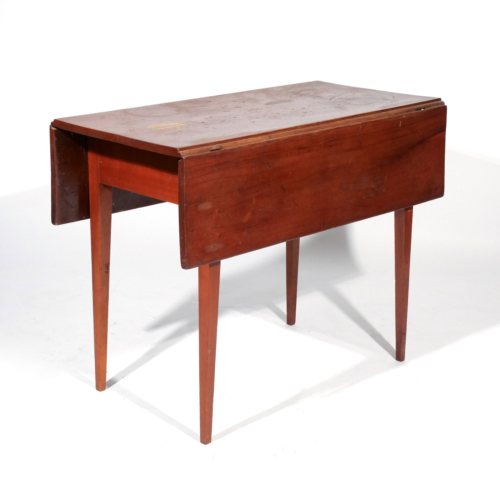 AMERICAN CHERRY DROP SIDE TABLE: 19th century, having square tapering legs h. 28 w. 36 d. 18 in. overall: 28 x 36 x 36 in. (open) Provenance: Descent through a prominent Greenwich, CT doctor's estate [In Situ Item] This item will