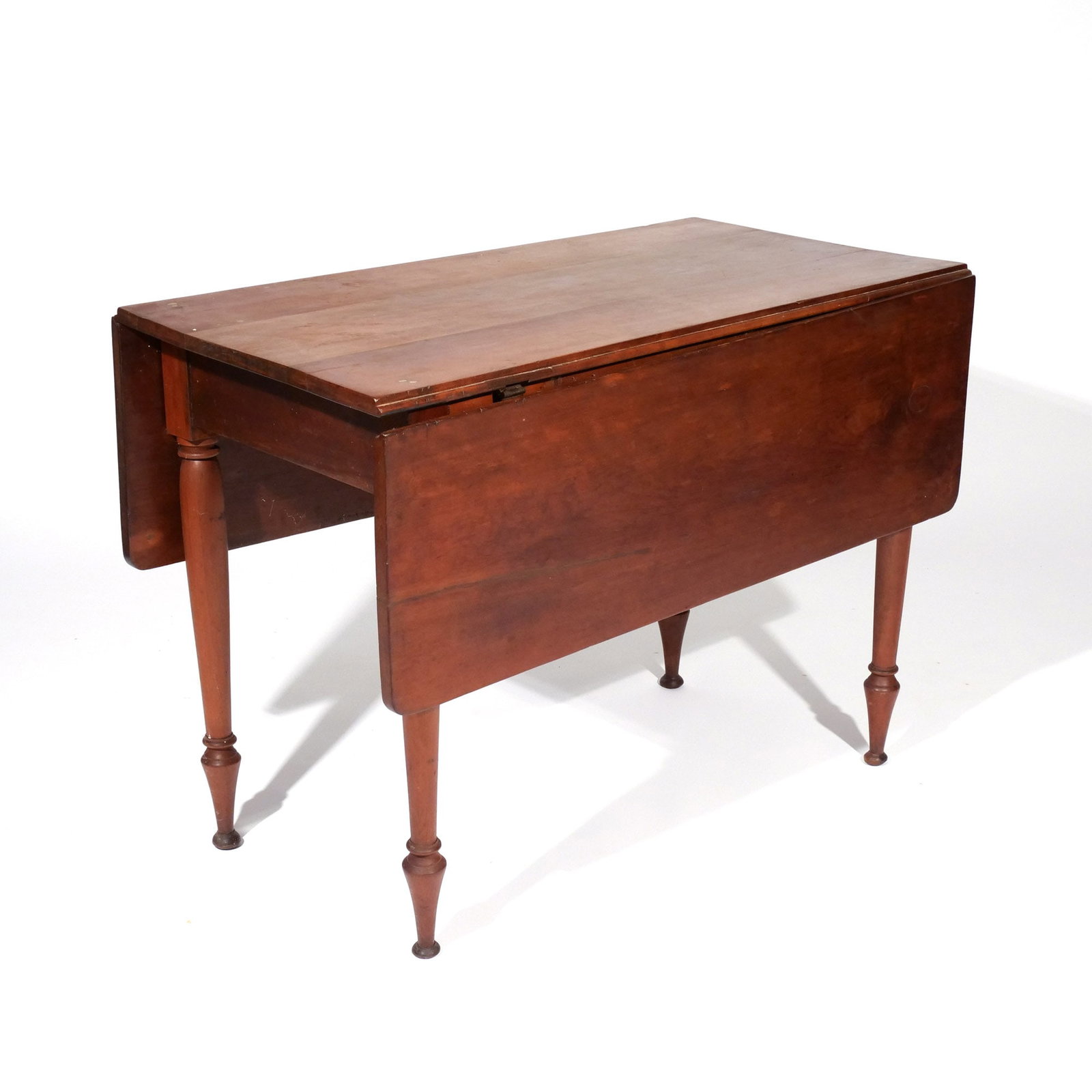 AMERICAN CHERRY & MAPLE DROP SIDE TABLE: 19th century, having round tapering legs with trumpet feet, three board top h. 28 w. 20 d. 38-1/2 overall: 28 x 46 x 38-1/2 in. (open) Provenance: Descent through a prominent Greenwich, CT doctor's